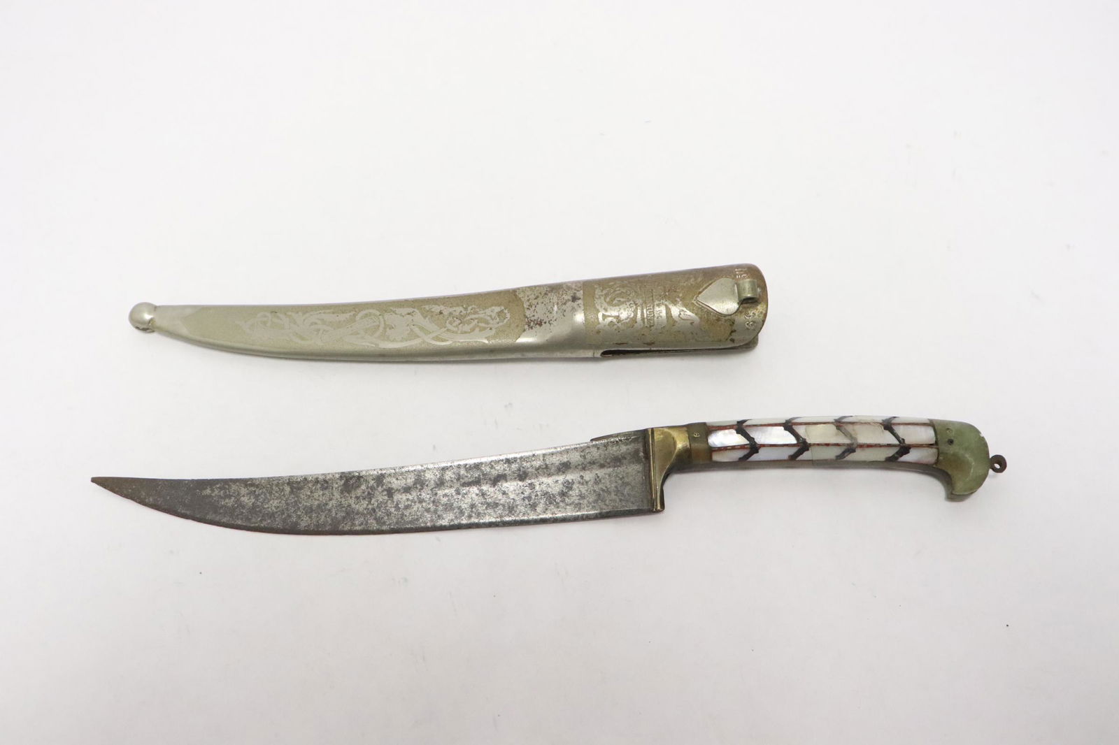A dagger with mother of pearl and jade finial: A dagger with mother of pearl and jade finial, 9.95"L