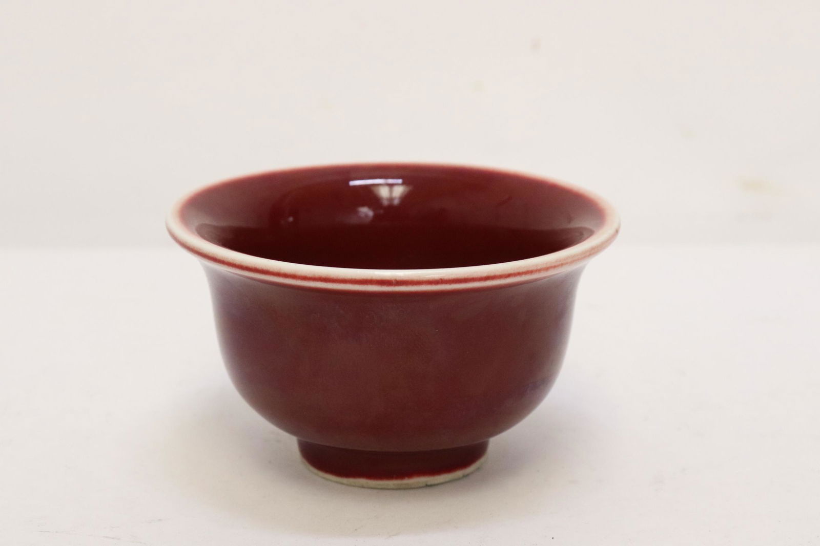 A red glazed porcelain tea bowl (1 of 10)