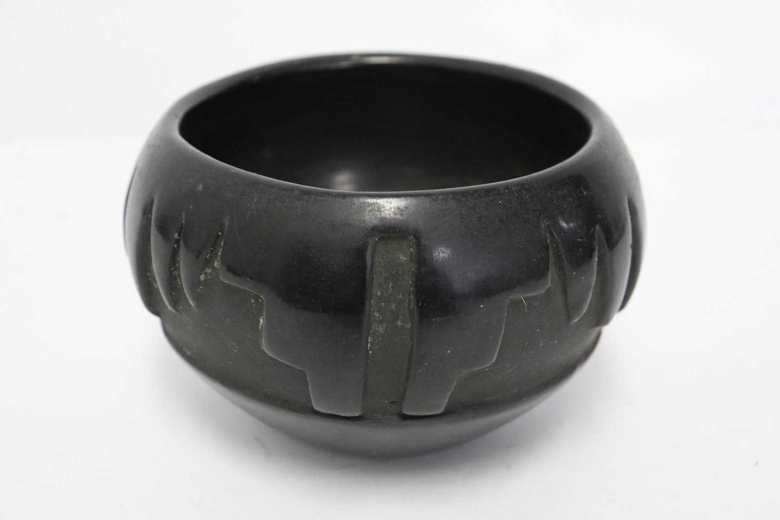 Santa Clara Indian black pottery jar signed by artist: Santa Clara Indian black pottery jar, minor chips, signed by artist, 3.24"x5.25"dia