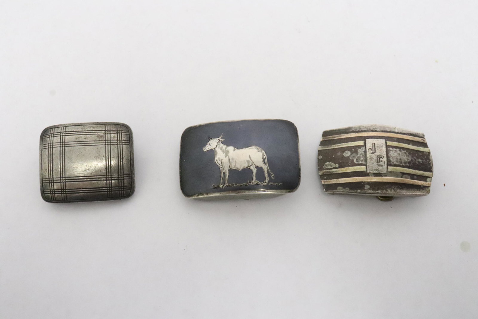 2 sterling belt buckles, one sterling & 14K belt buckle: 2 sterling belt buckles (1.35"x2", 1.25"x1.5"), and one sterling and 14K belt buckle (1.25"x1.88")