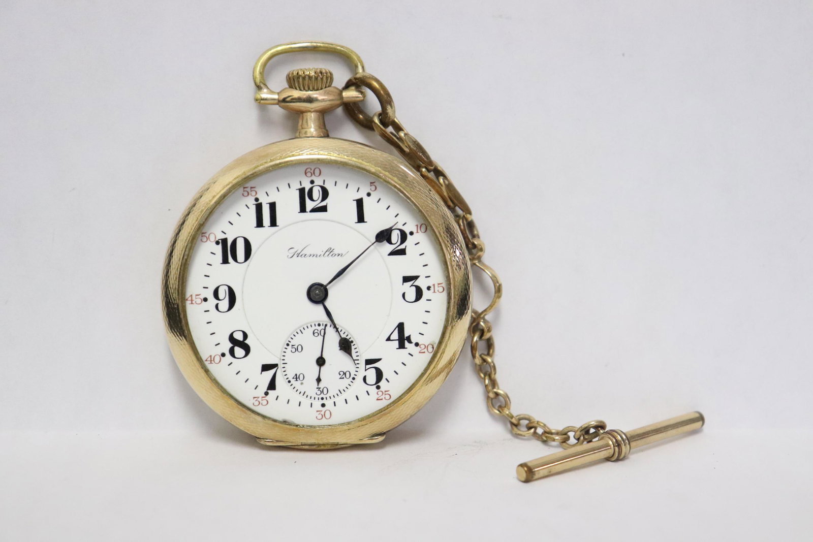 Hamilton pocket watch with watch fob: Hamilton pocket watch (1.95"dia) with watch fob, crystal loose