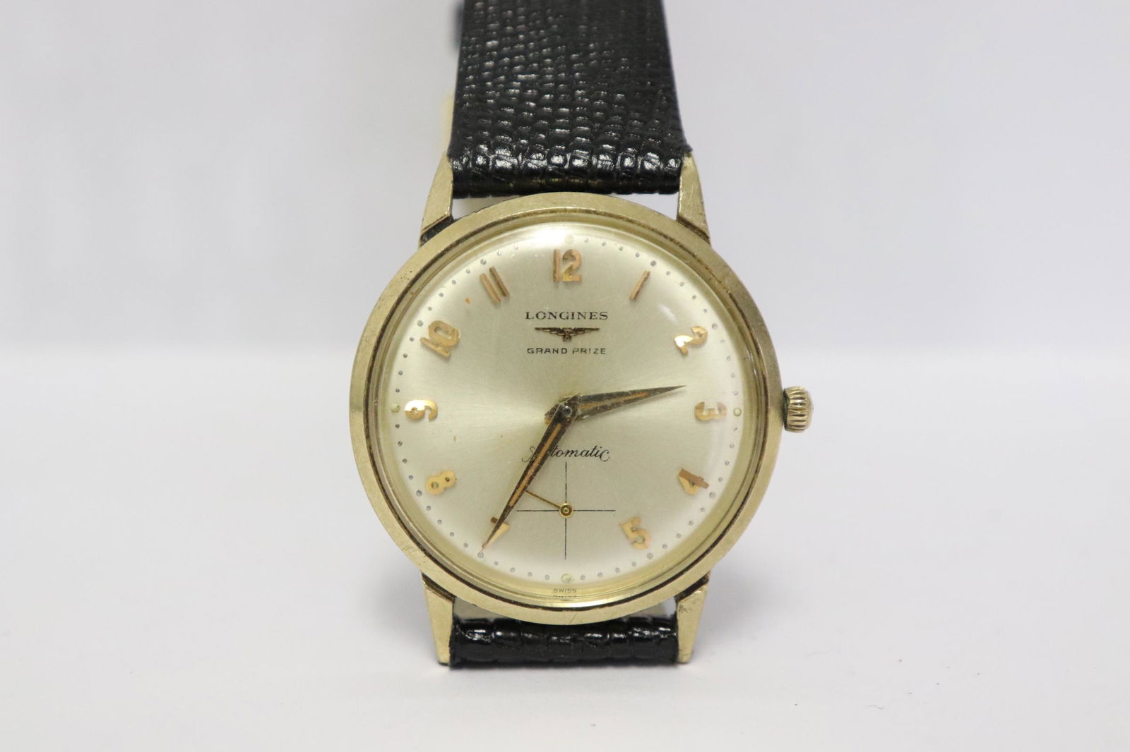 Longines man's grand prize automatic wrist watch: A Longines man's grand prize automatic wrist watch