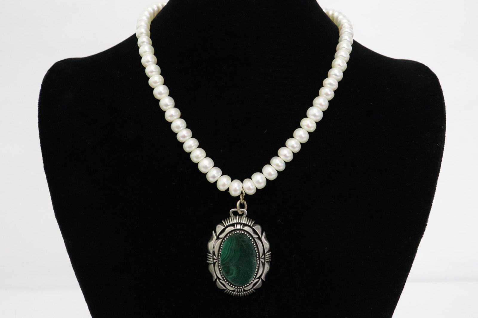 A silver pendant w/ malachite & pearl necklace: A silver pendant (0.26"x1.8"x1.26") with malachite attached with freshwater pearl (0.25"x0.3"dia) necklace, malachite crack