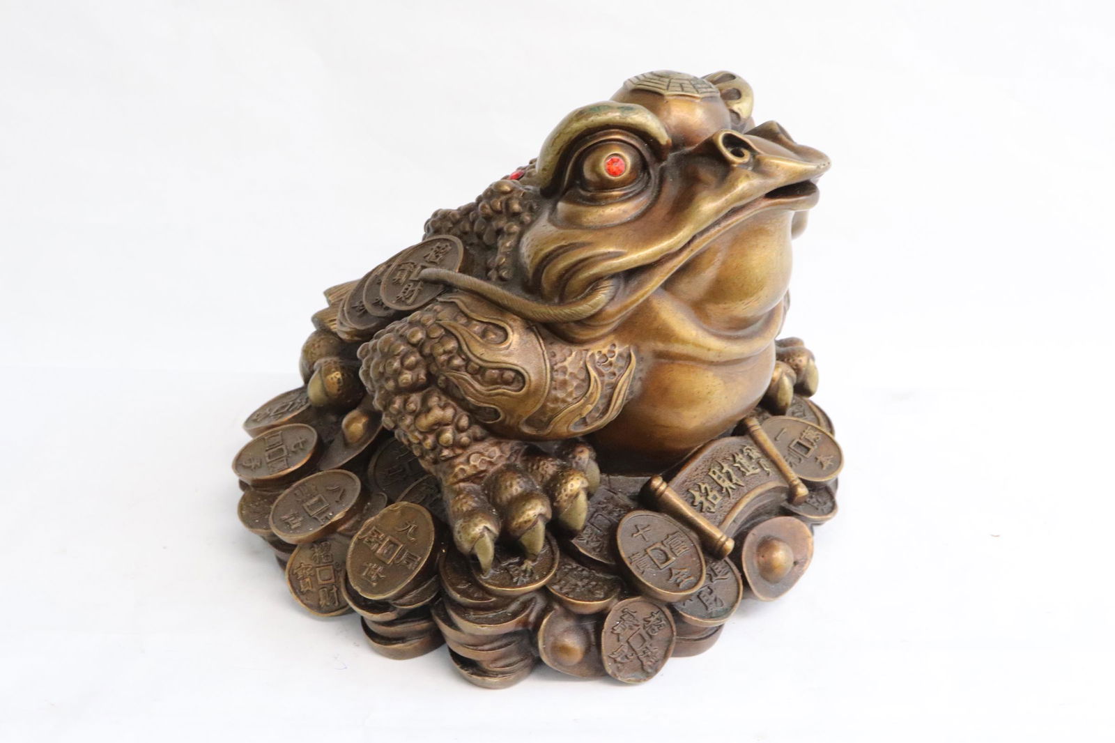 A copper/ brass sculpture of frog (1 of 8)