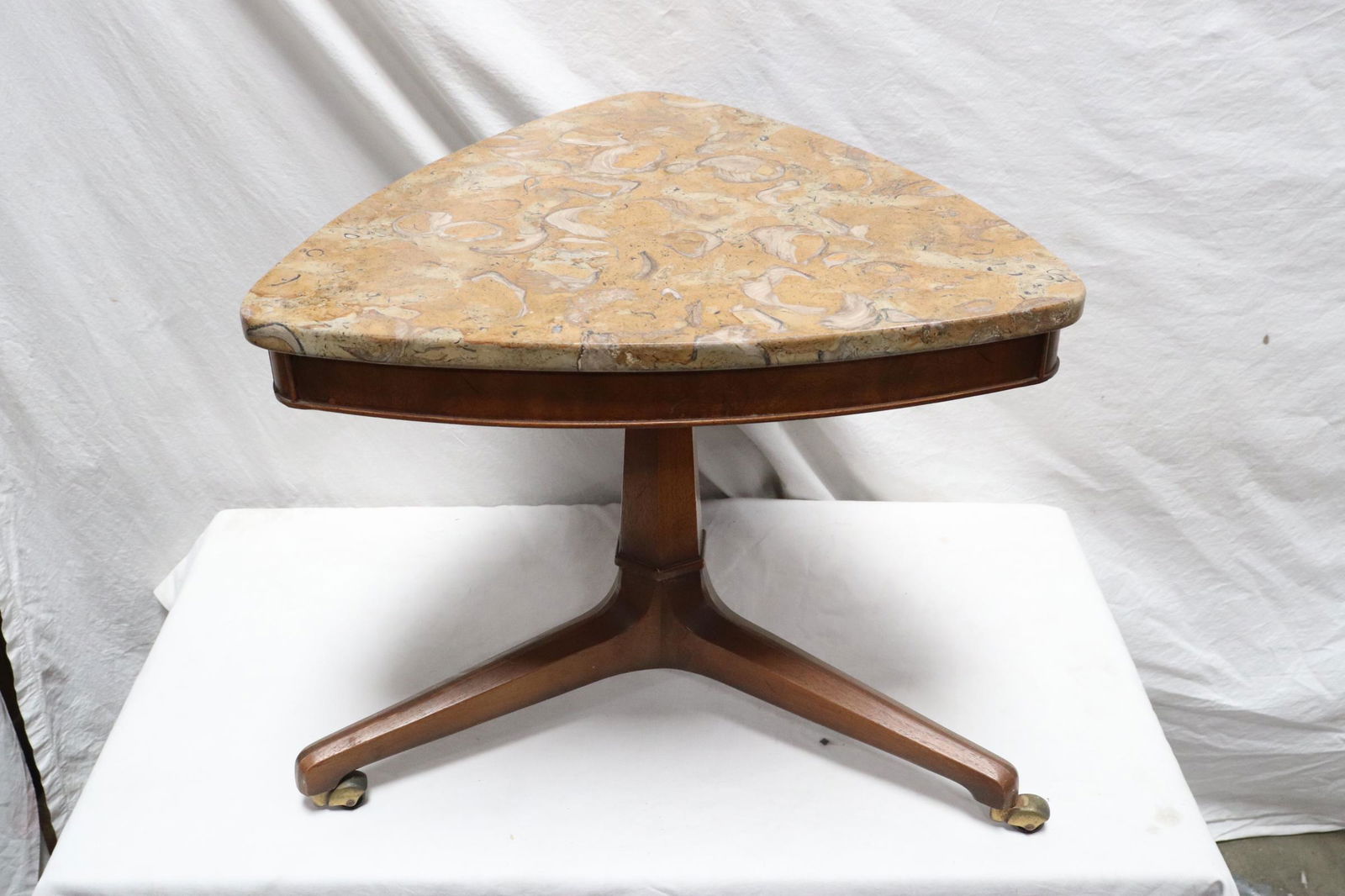 A modern marble top teak wood triangular table (1 of 10)