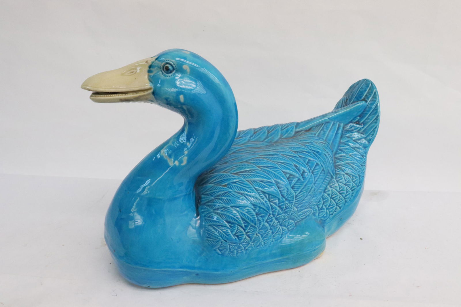 A blue glazed earthenware duck: A blue glazed earthenware duck, 8.2"H