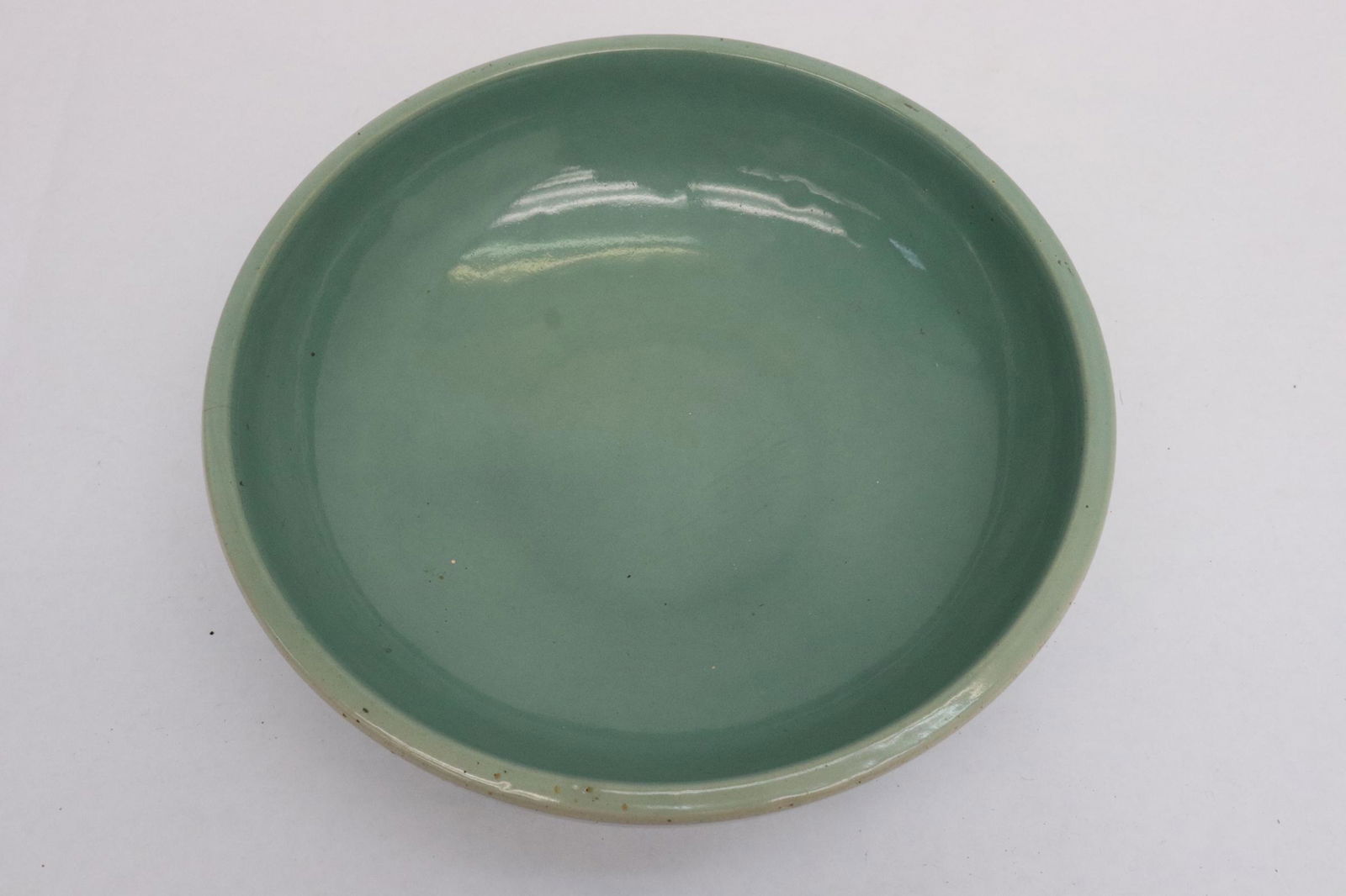 A large celadon bowl: A large celadon bowl, 3.6"x11.2"dia