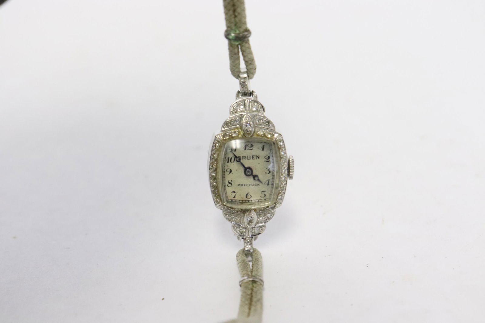 14K lady's diamond wrist watch by Gruen: 14K lady's art deco diamond wrist watch by Gruen, set with small diamonds, tdw approx. 0.50ct, wt. 8.5gm