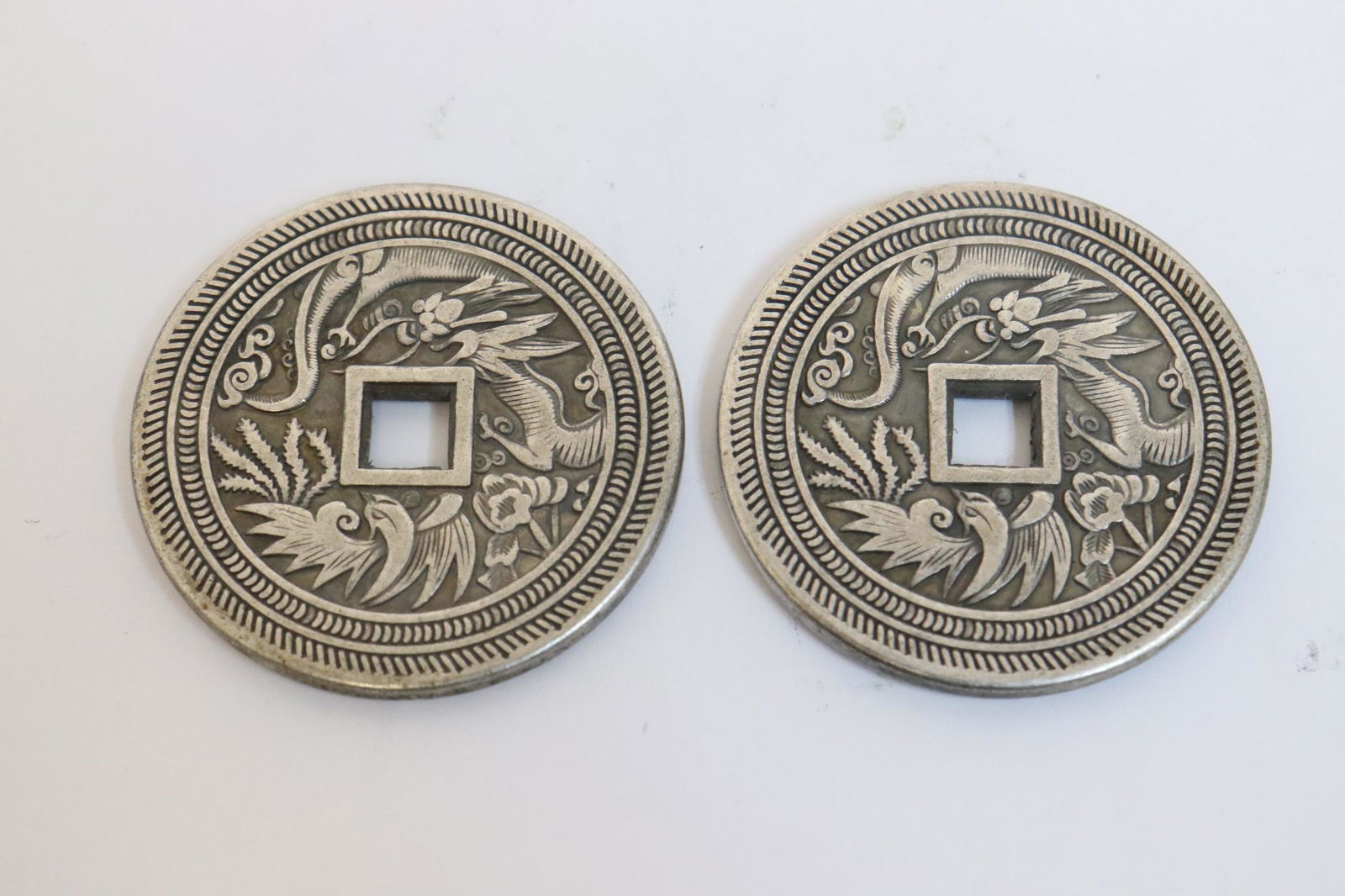 2 White bronze coin like ornaments (1 of 7)