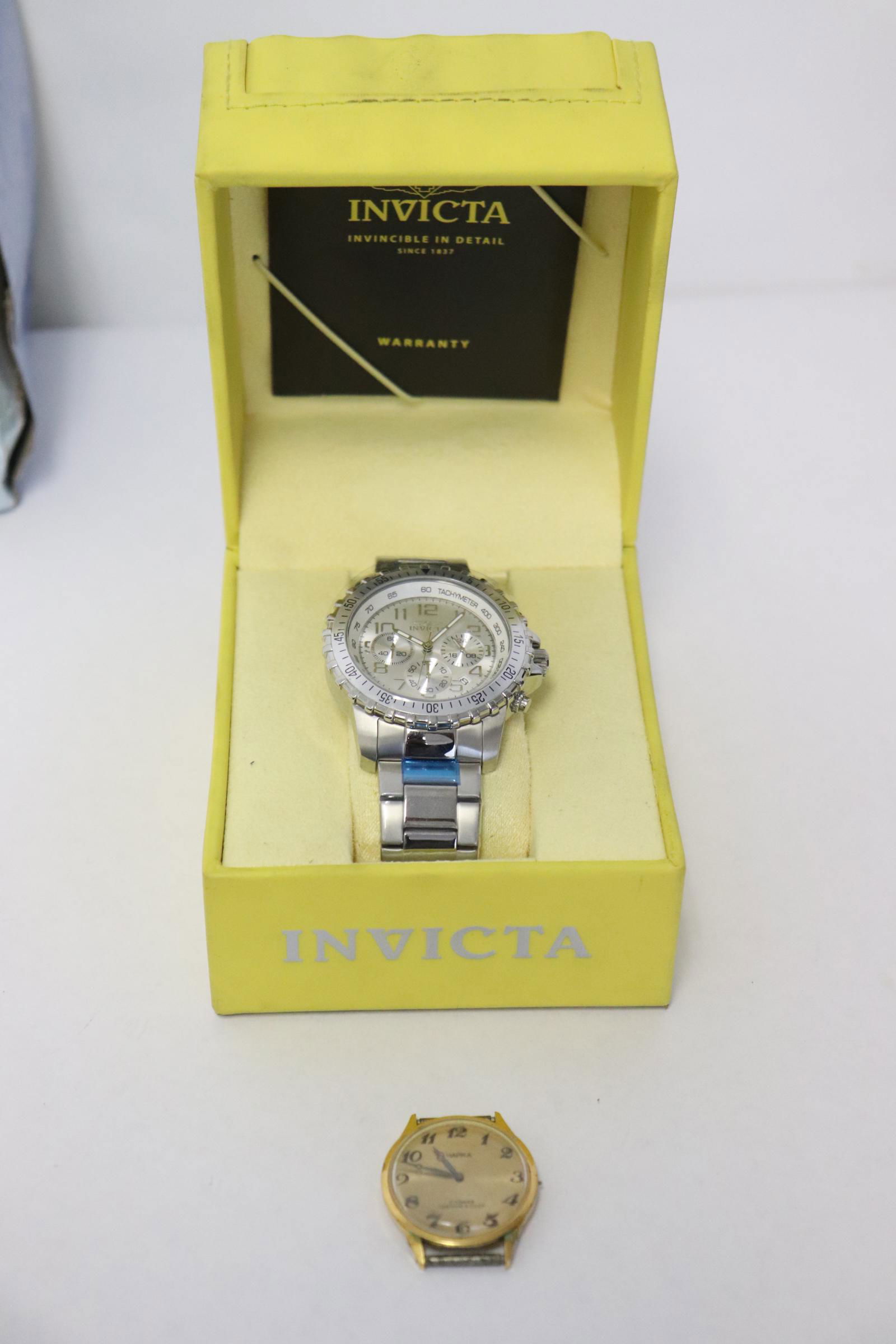 Invicta watch with box, & a vintage Russian watch: An Invicta watch in new condition with box, and a vintage Russian watch (no band)