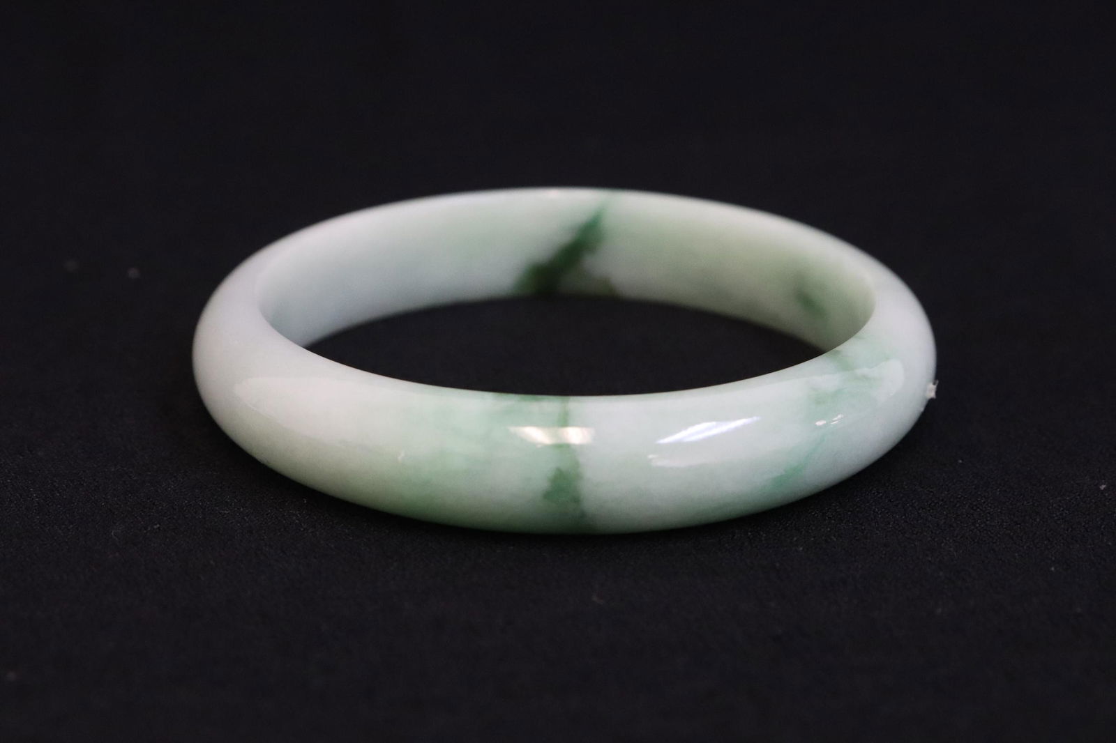 A natural color jadeite bangle (1 of 8)