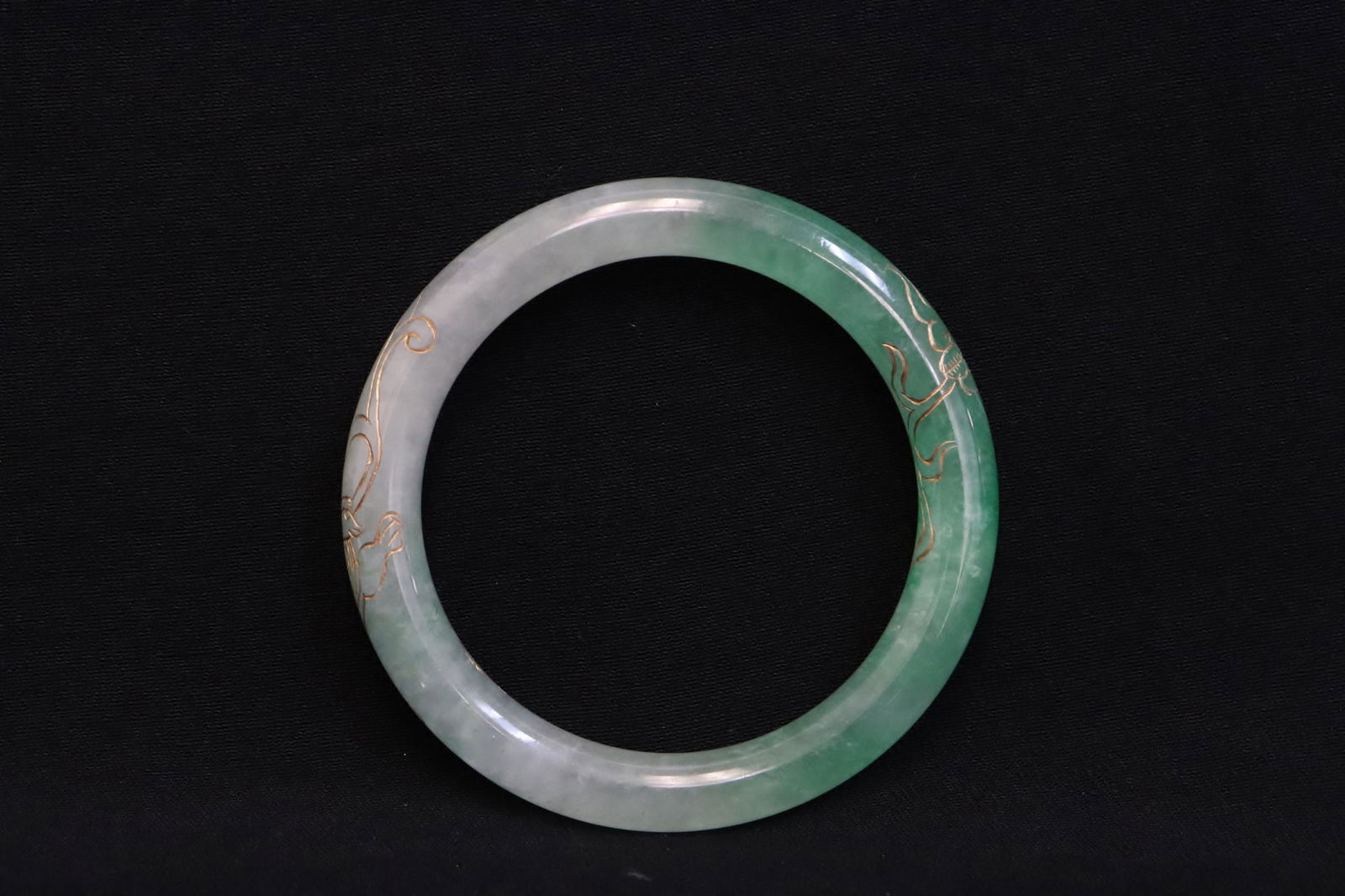 A jadeite like bangle: A jadeite like bangle, 0.35"x2.9"od(2.2:id)