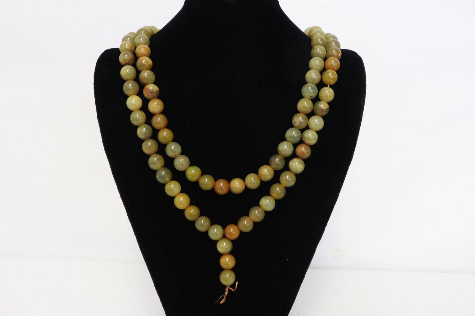 A long necklace with jade like beads (1 of 10)