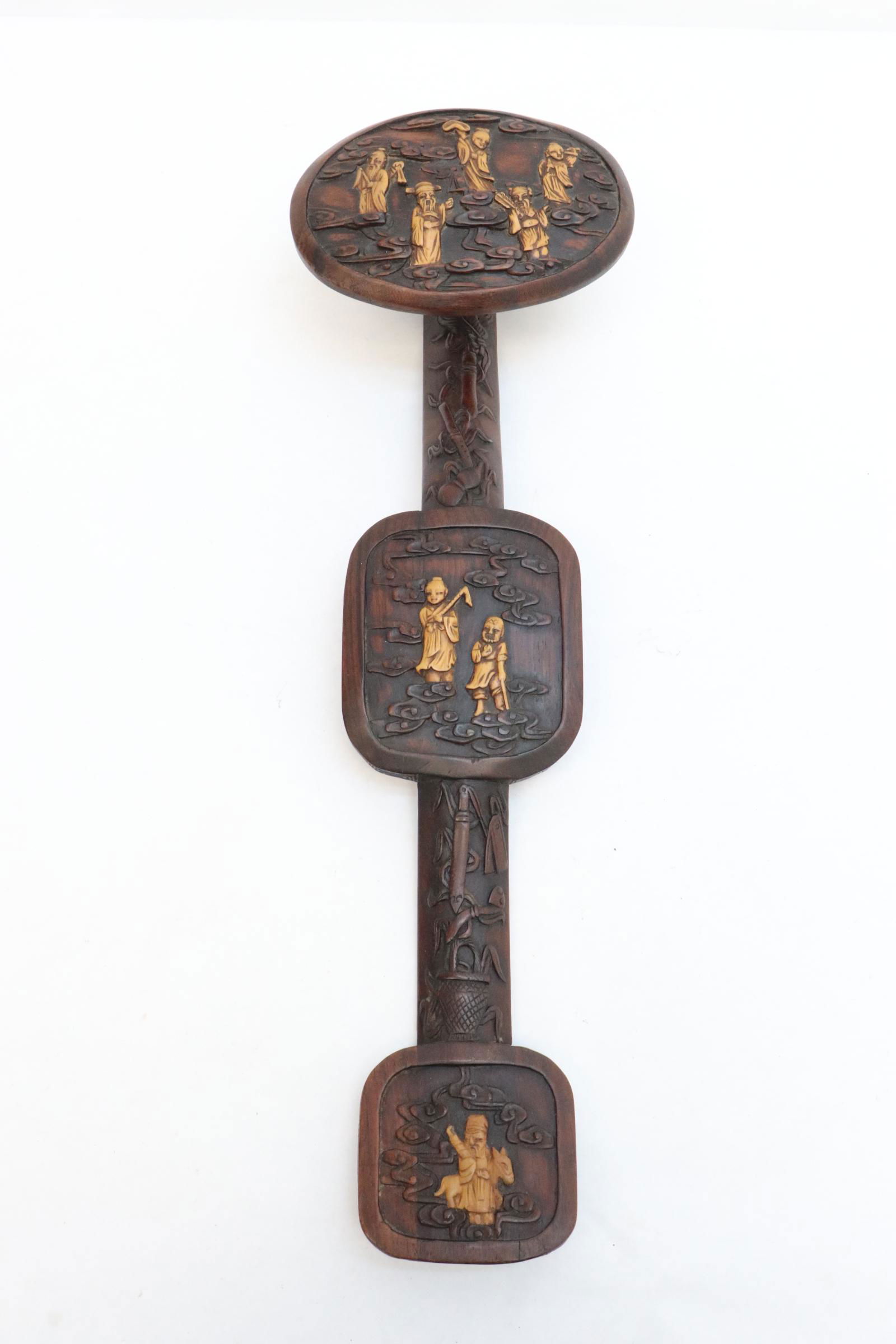 Chinese antique huanghuali wood ruyi: A rare Chinese antique huanghuali wood ruyi with huangyang wood carved figure decoration to depict 8 immortals, 18.2"L
