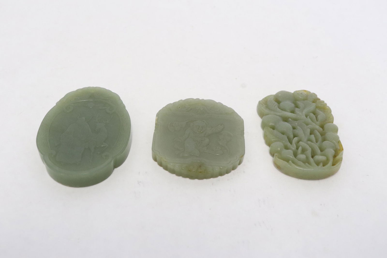 3 Chinese celadon jade carved ornaments: 3 Chinese celadon jade carved ornaments, 0.3"x2.1"x1.75" - 0.32"x2.5"x1.75"