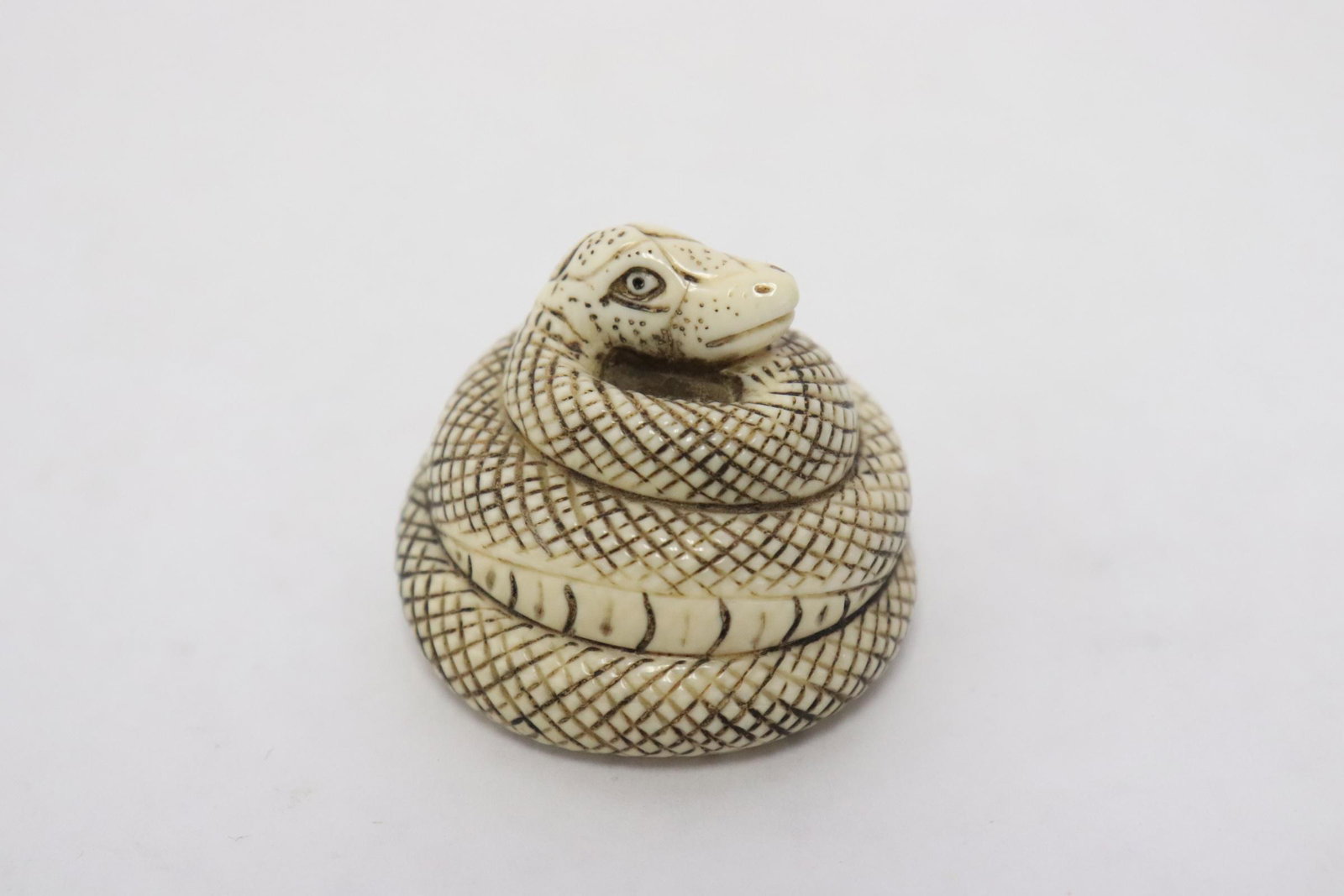 Japanese bone carved netsuke, signed: Japanese bone carved netsuke in the form of snake, signed, 1"H
