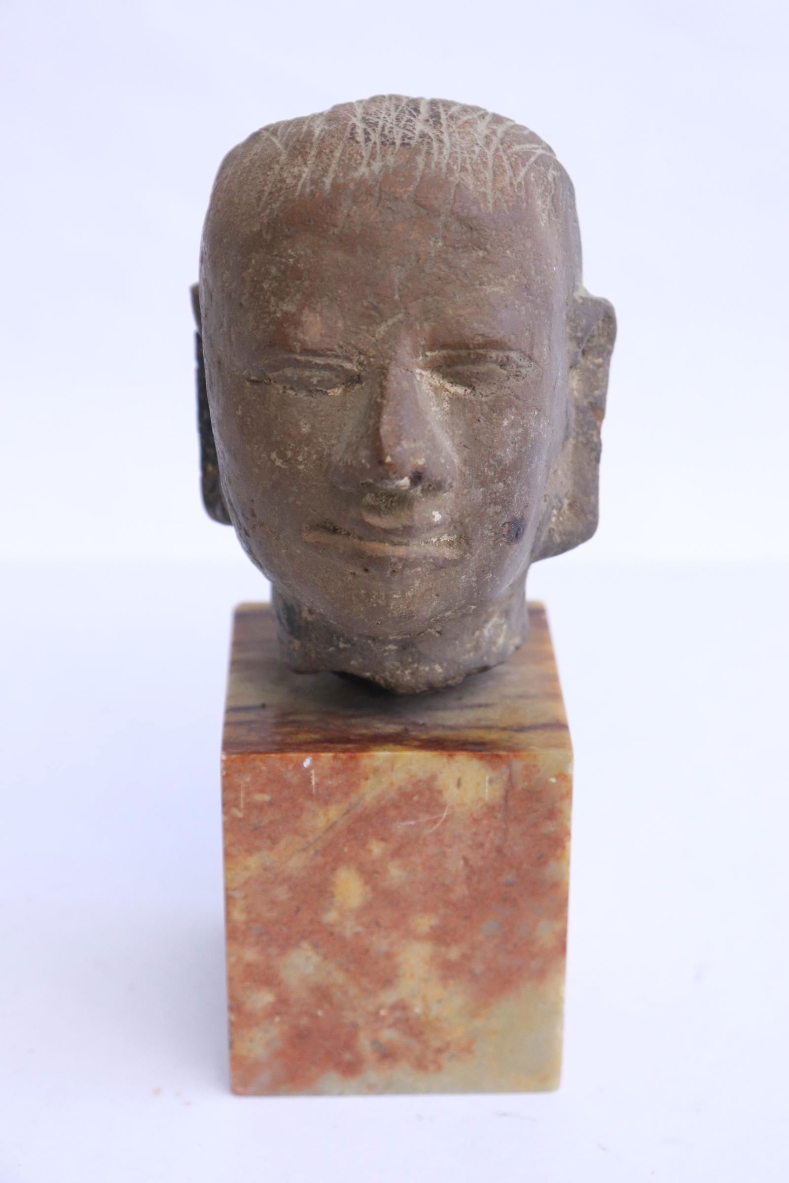 Antique stone carved head on onyx like stone stand (1 of 8)