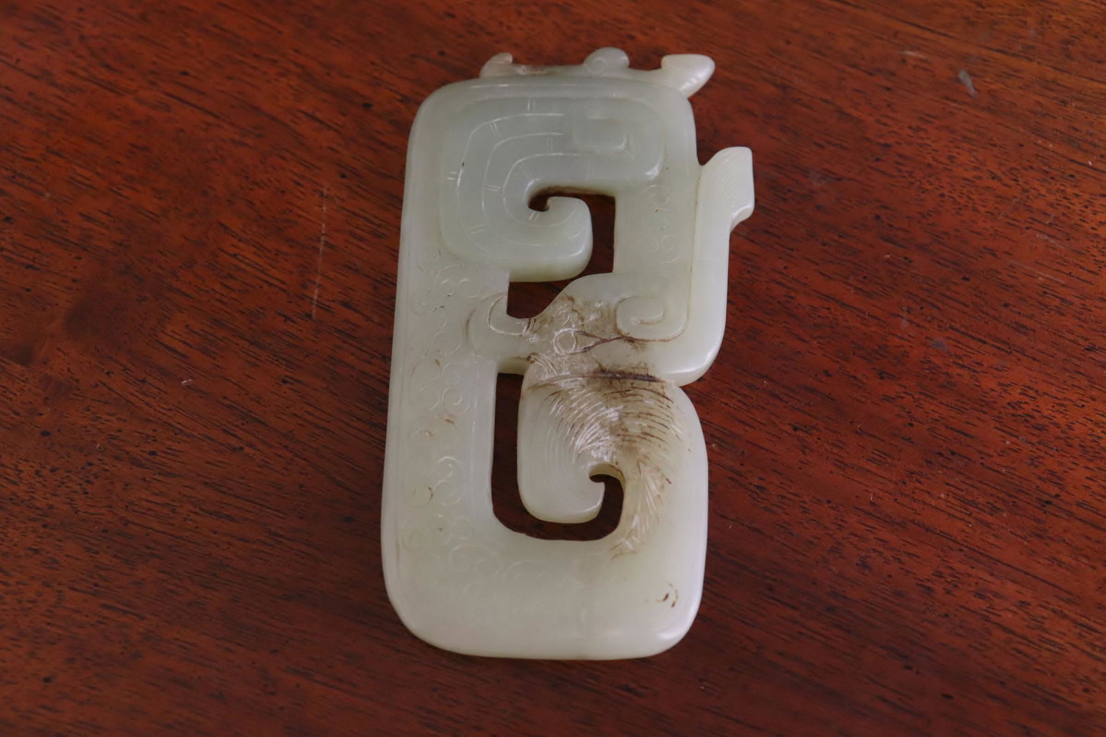 A vintage celadon jade carved ornament: A very fine vintage celadon jade carved ornament, 0.3"x3.6"x2"