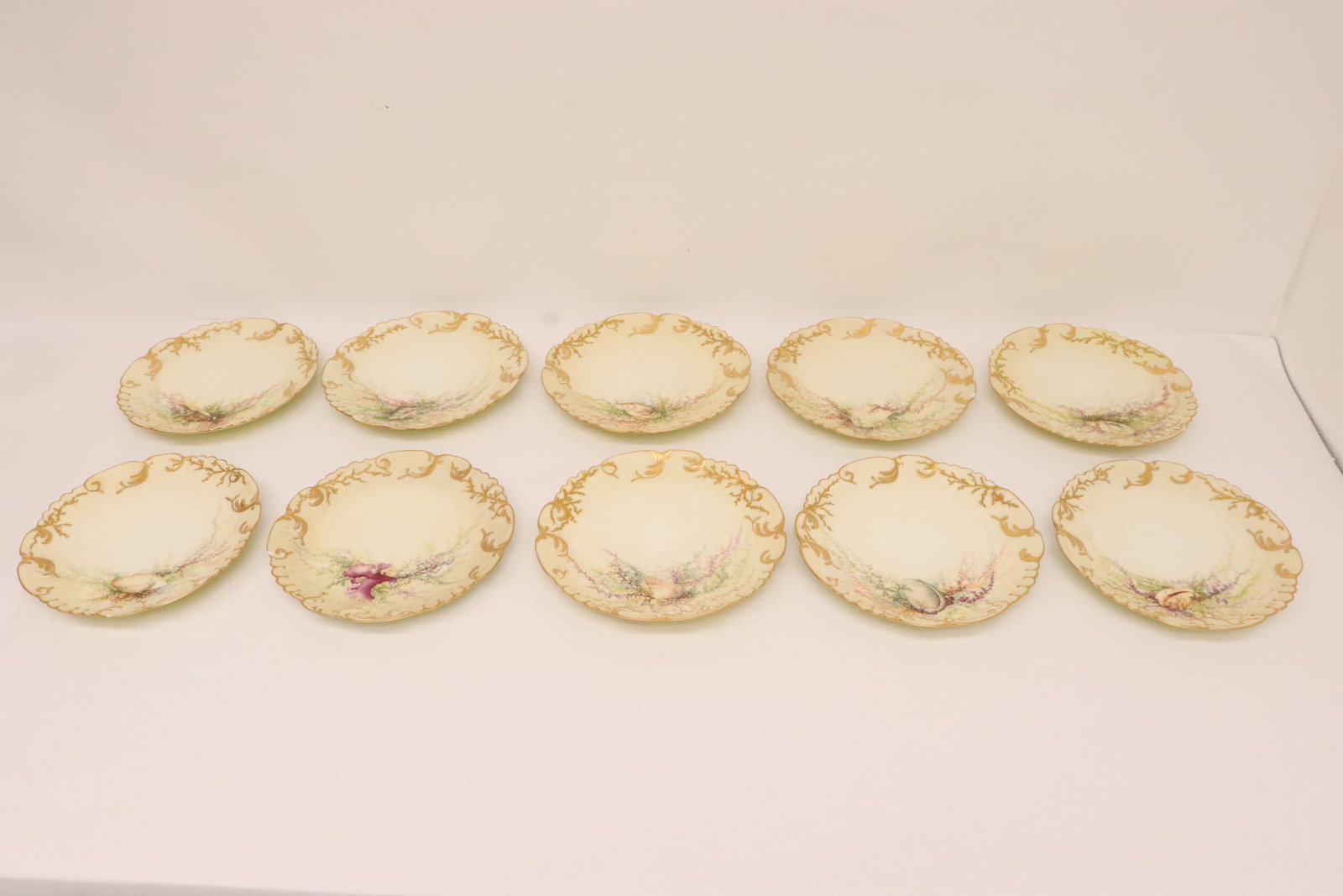 10 fancy French Limoge plates, minor chips: 10 fancy French Limoge plates, minor chips, 1"x8.6"dia