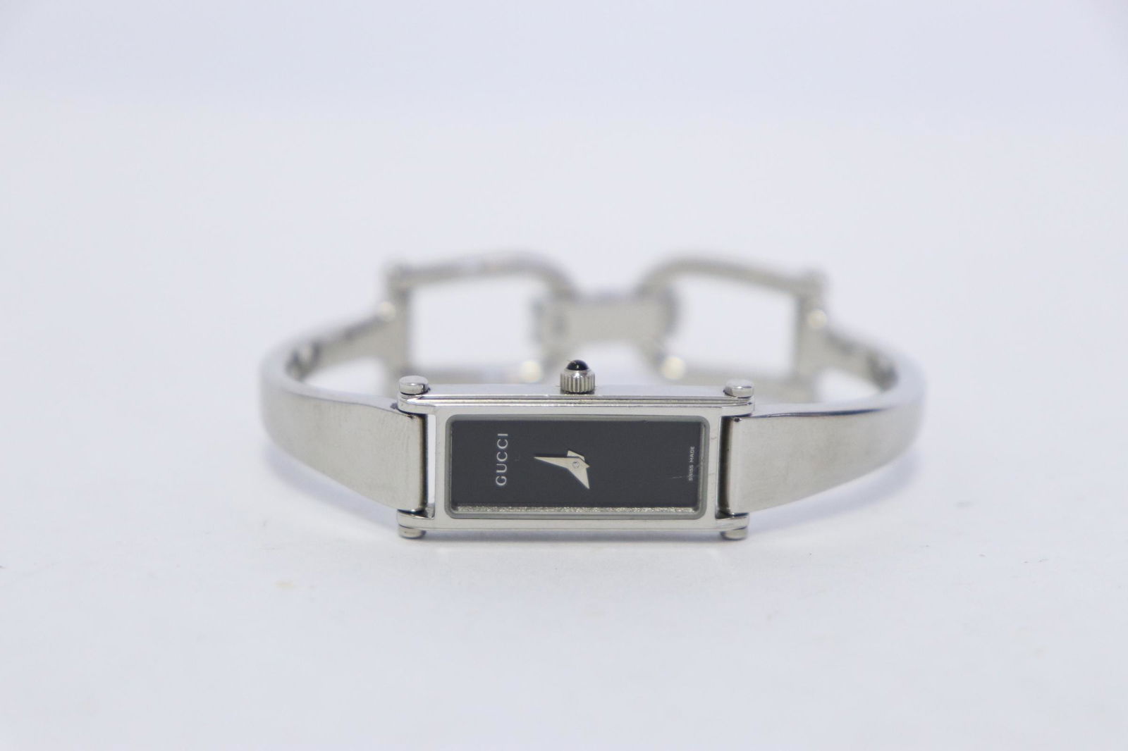 A Gucci watch: A Gucci watch, crystal scratches