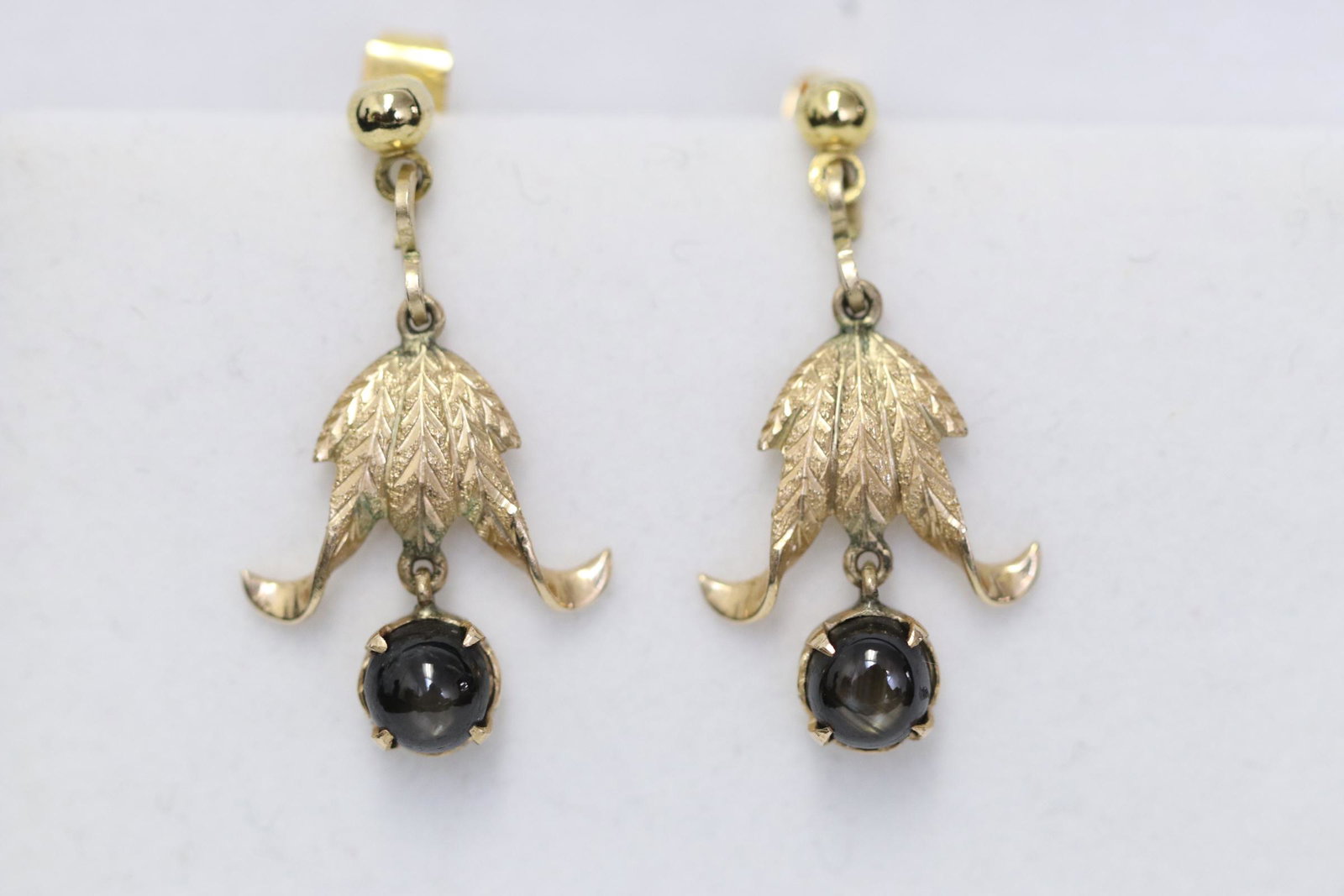Pair 14K Y/G earrings set with black sapphire (1 of 9)