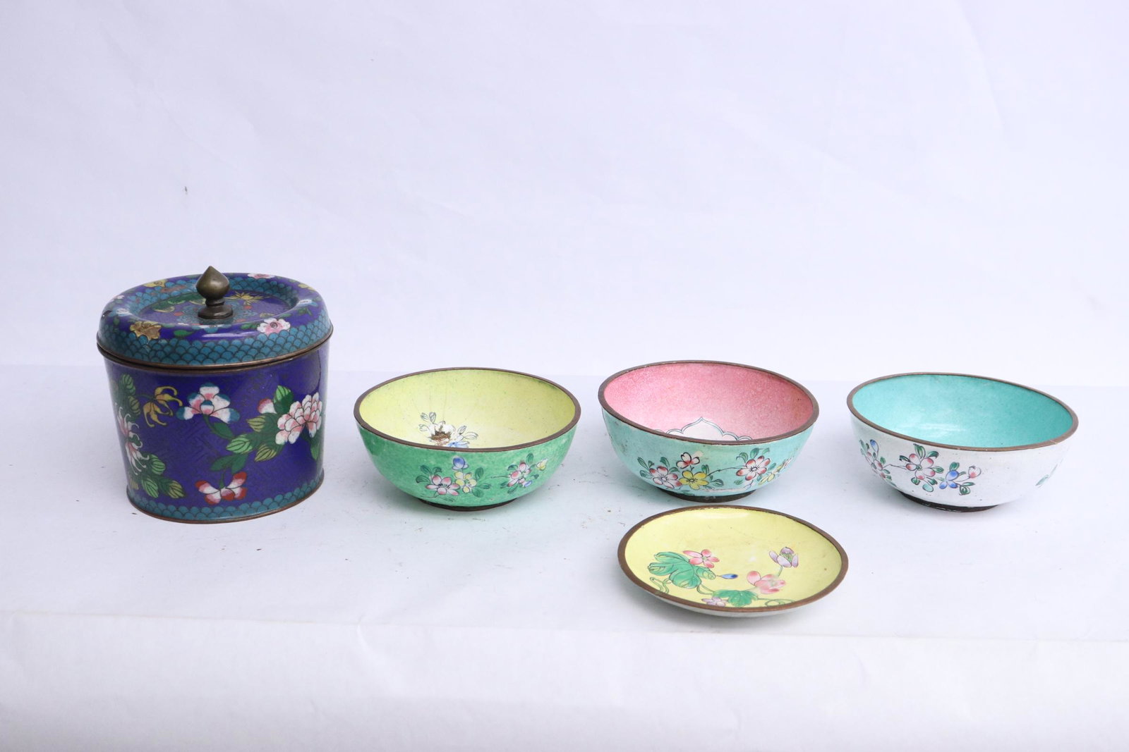 5 pieces: 5 pieces; Chinese covered tea caddy (4.5"x4.35"dia), and 4 enamel on copper bowls (1.75"x4.3"dia)