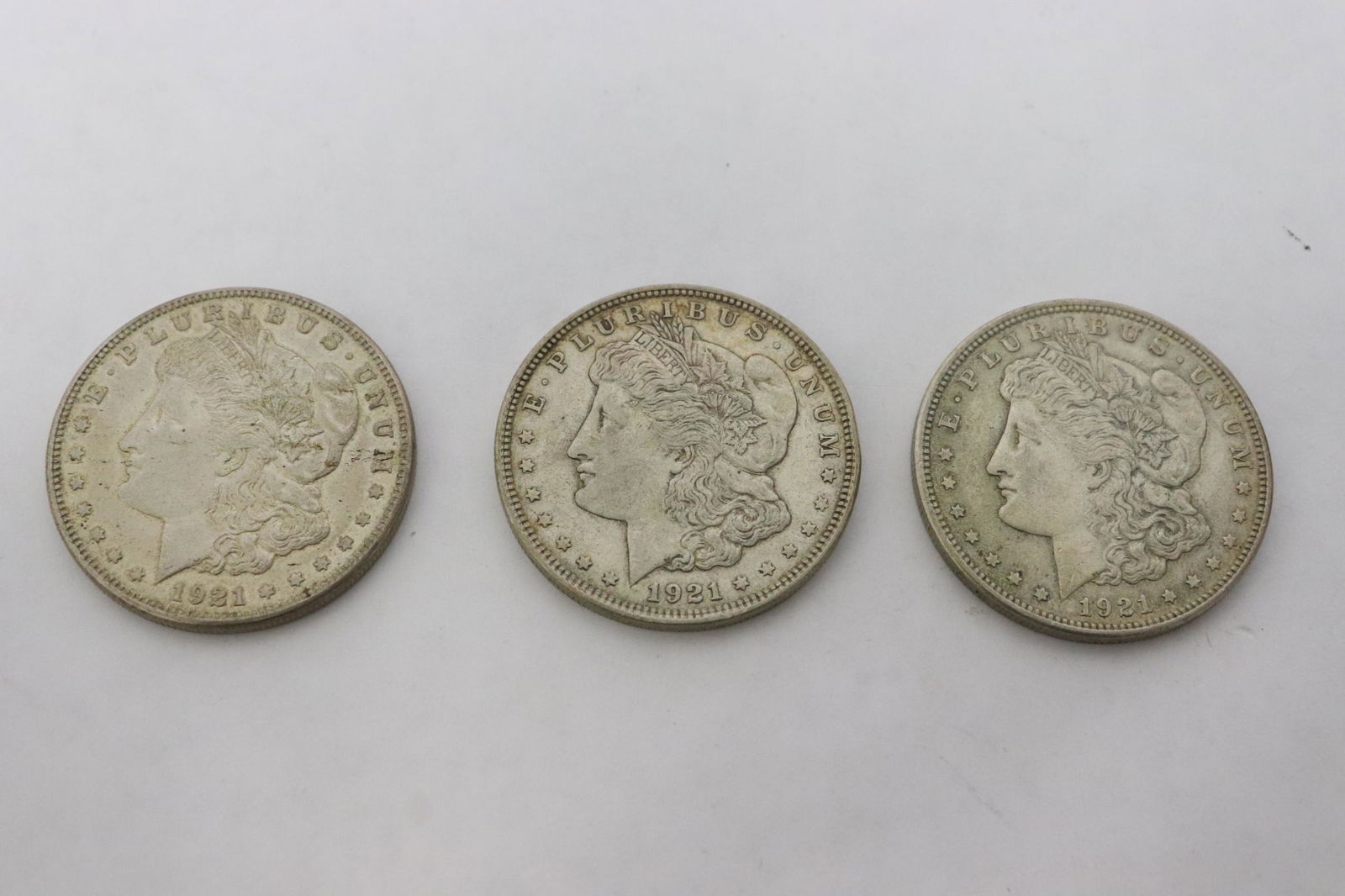Three 1921 Morgan silver dollars (1 of 8)