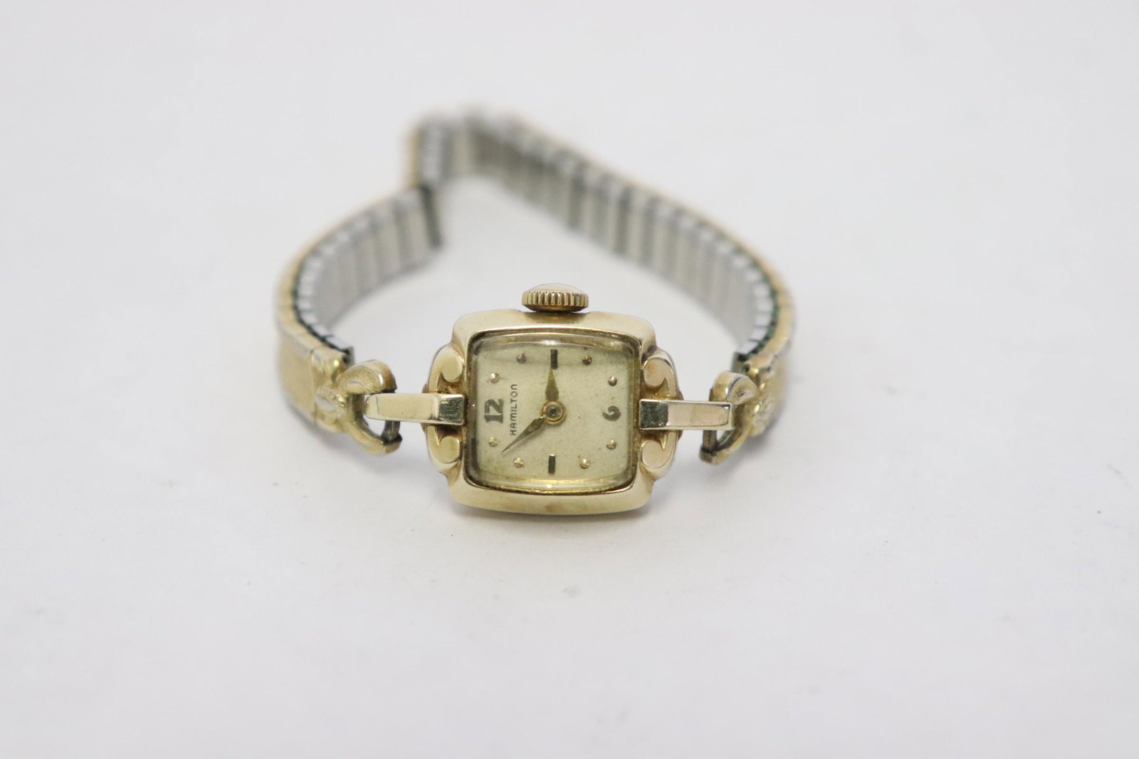 A 14K Y/G Hamilton lady's wrist watch: A 14K Y/G Hamilton lady's wrist watch
