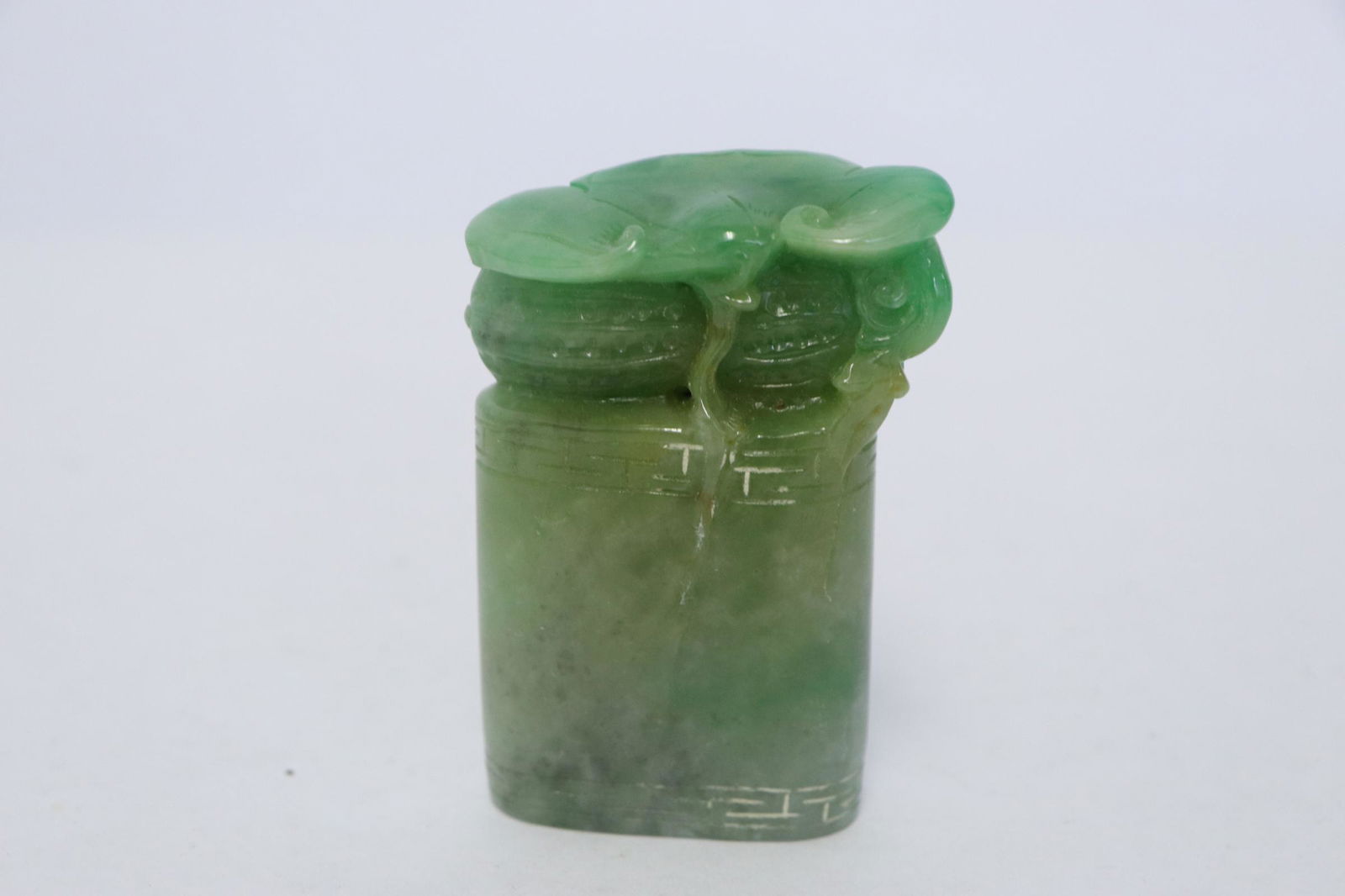 A rare apple jadeite seal: A rare apple jadeite seal, the top in Lingzhi motif, 0.8"x2.65"x1.6"