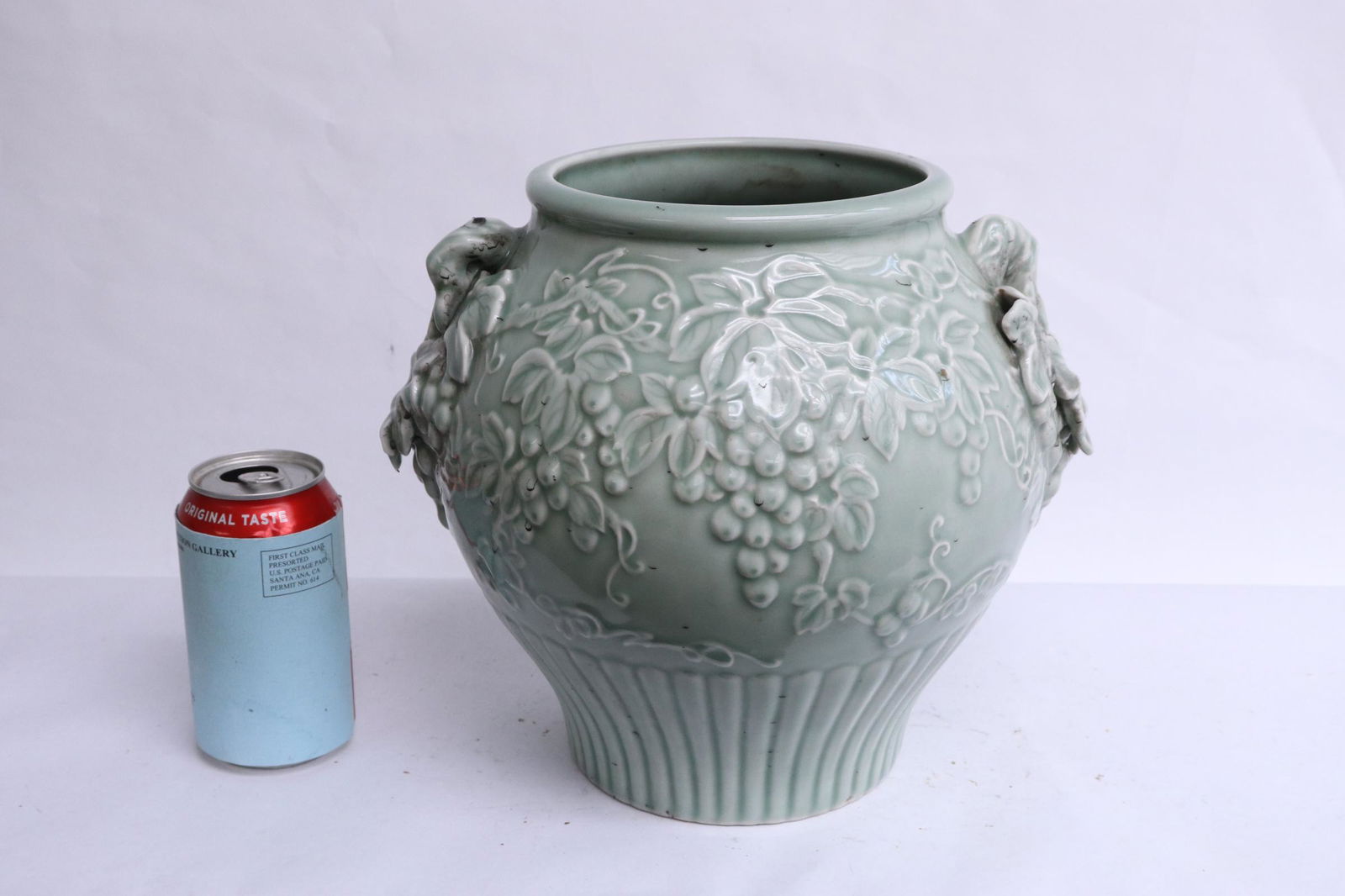 Chinese vintage celadon jar: Chinese vintage celadon jar decorated with grape vine in relief, 9.6"x11.25"x9.75"
