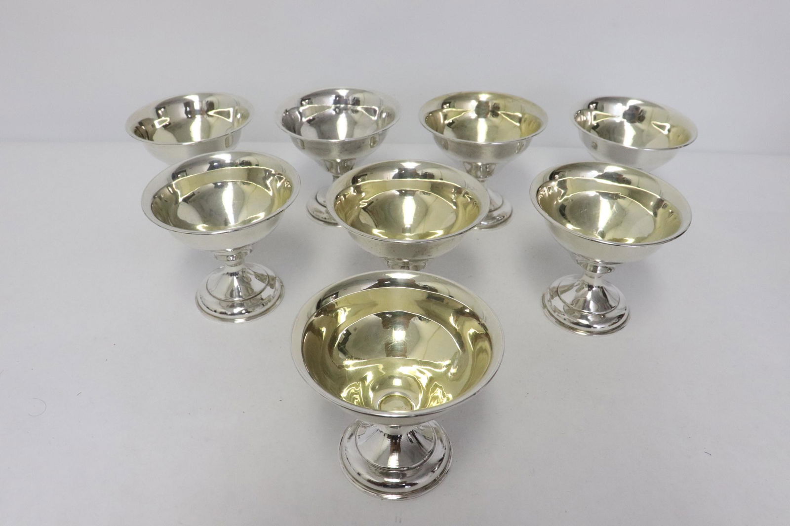 8 weighted sterling wine cups: 8 weighted sterling wine cups, total wt. 723gm, 3.25"x3.7"dia