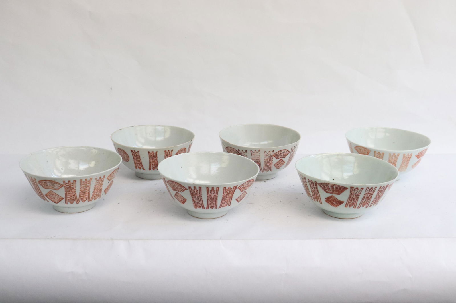 6 Chinese red and white porcelain bowls: 6 Chinese red and white porcelain bowls, edge flea bites, 2.35"x4.7"dia