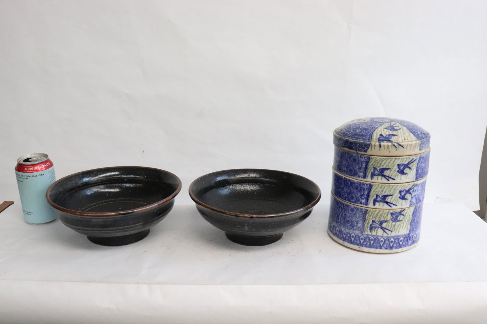 2 earthenware large bowls, & a stacked candy set: 3 pieces; 2 earthenware large bowls (3.5"x8.95"dia), and a blue and white stacked candy set (8"x6.15"dia)