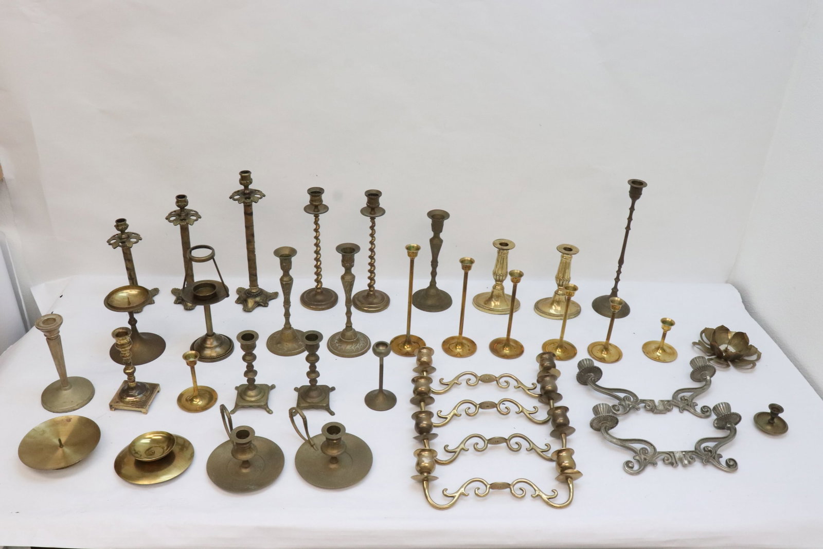 Large lot of brass items, most candle holders: Large lot of brass items, most candle holders