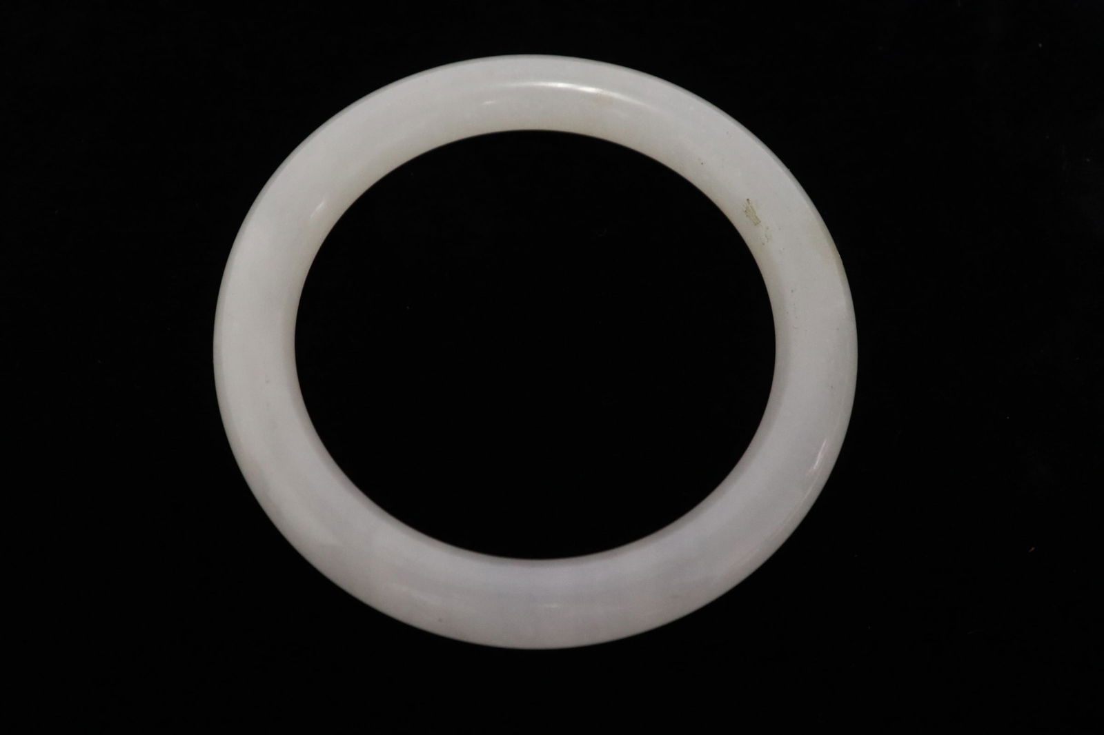 A fine Chinese white jade bangle (1 of 6)