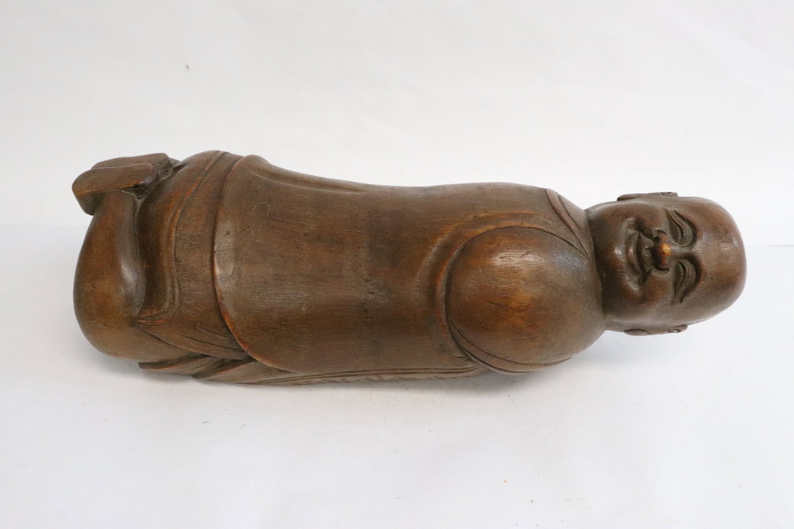A vintage Chinese bamboo carved pillow: A vintage Chinese bamboo carved pillow in the form of baby, 13.5"L