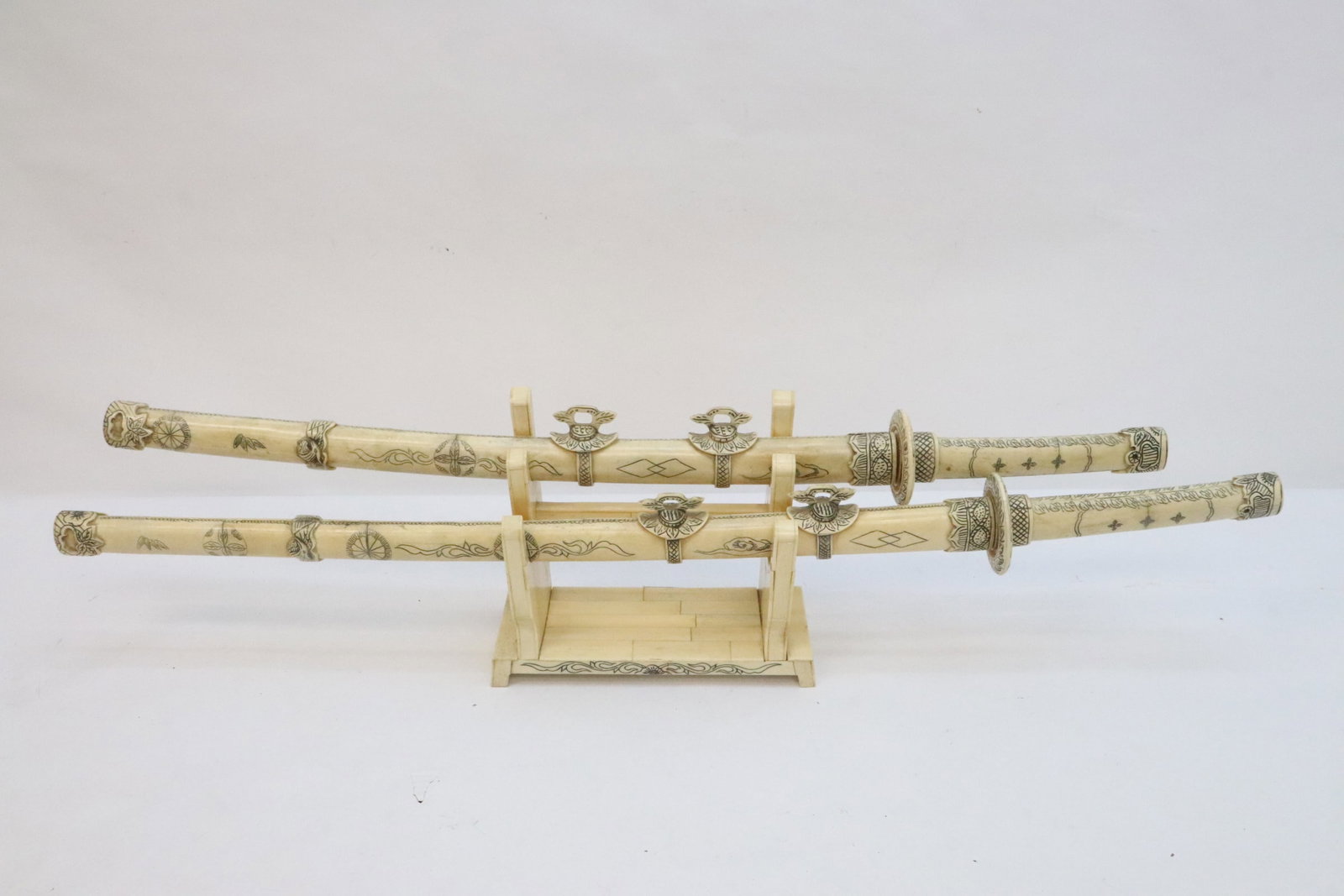 2 Japanese samurai sword w/ bone scabbard & stand: 2 Japanese samurai sword (32.2"L, 36.15"L) with bone carved scabbard and bone stand