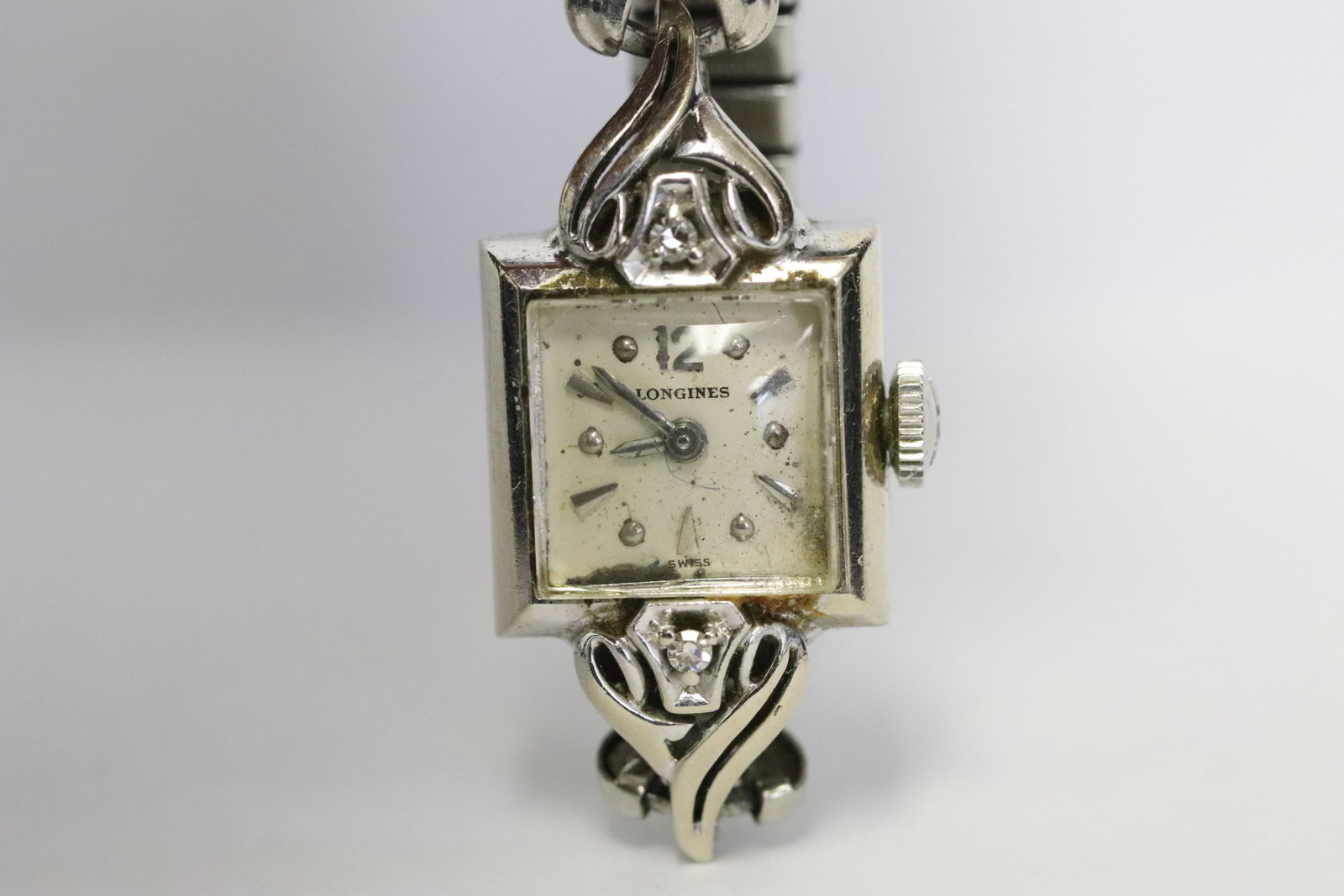 14K W/G lady's Longines diamond wrist watch: Fine 14K W/G lady's Longines diamond wrist watch with small diamonds, wt. 15.8gm