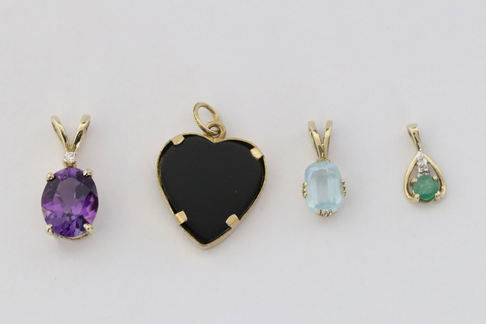 Four 14K Y/G pendants set with stones (1 of 9)