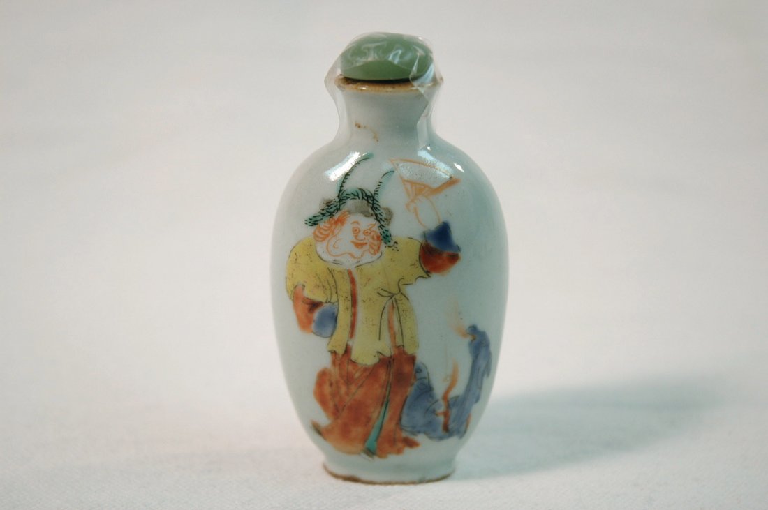 Chinese wucai porcelain snuff bottle: Chinese wucai porcelain snuff bottle, one side painted with a clown, the other side with calligraphy (3.50"H)