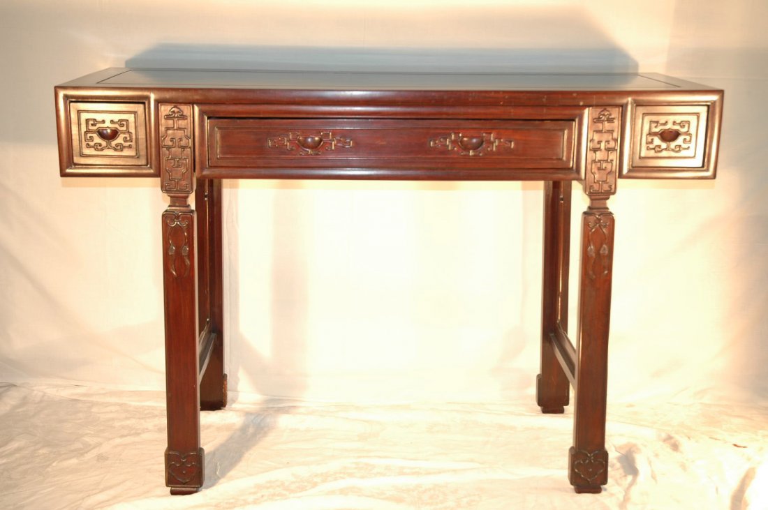 Chinese rosewood altar table: Chinese rosewood altar table. The side panels carved with geometric pattern in relief. 3 drawers at front (33.5"hx50"Wx17.75"D)