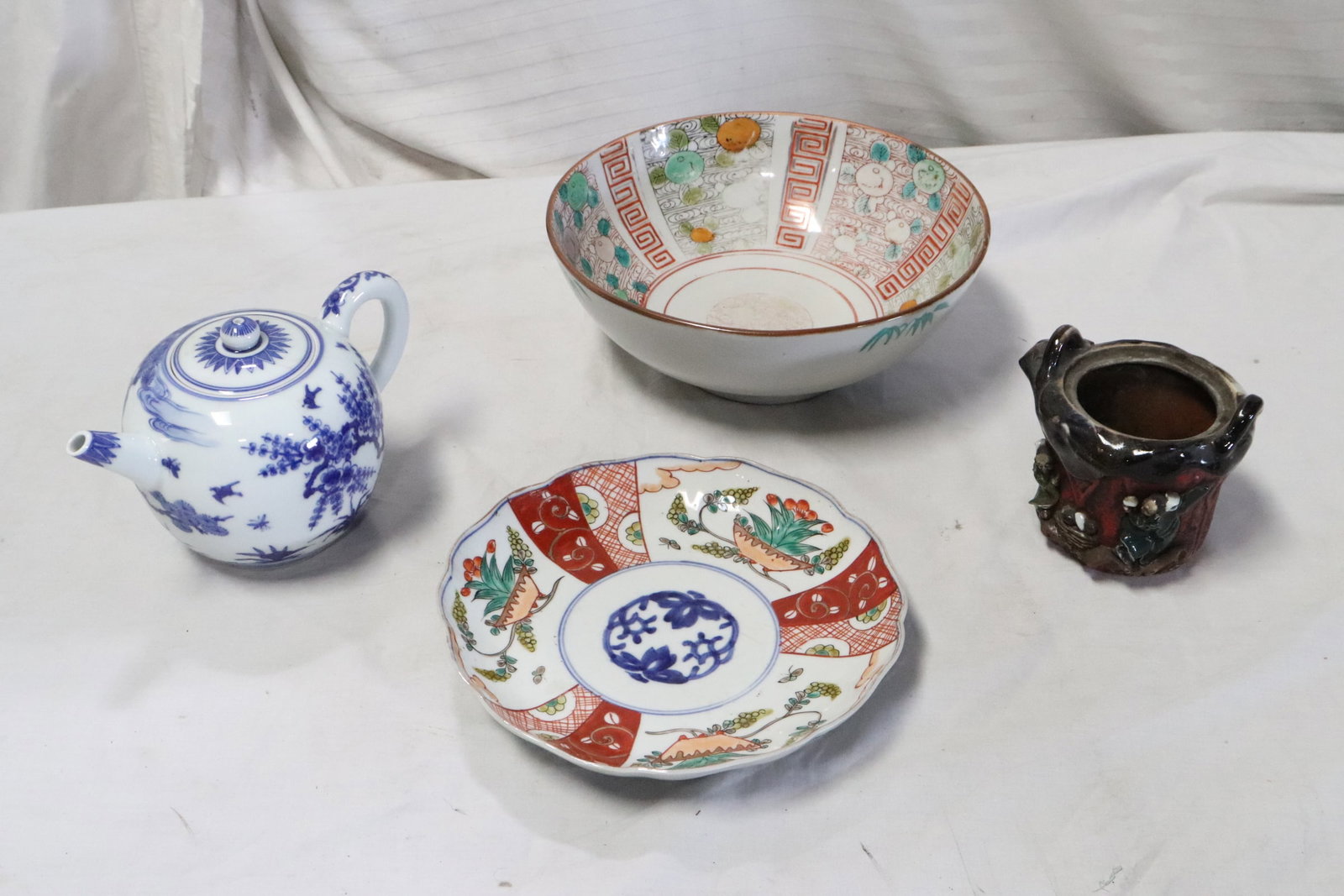 4 pieces Japanese porcelain: 4 pieces Japanese porcelain; antique imari plate (1.5"x8.7"dia), imari bowl (3.8"x9.8"dia), blue and white teapot (5.2"x7.8"x5") and antique Sumidagawa jar (4.2"x4.9"x4.3")