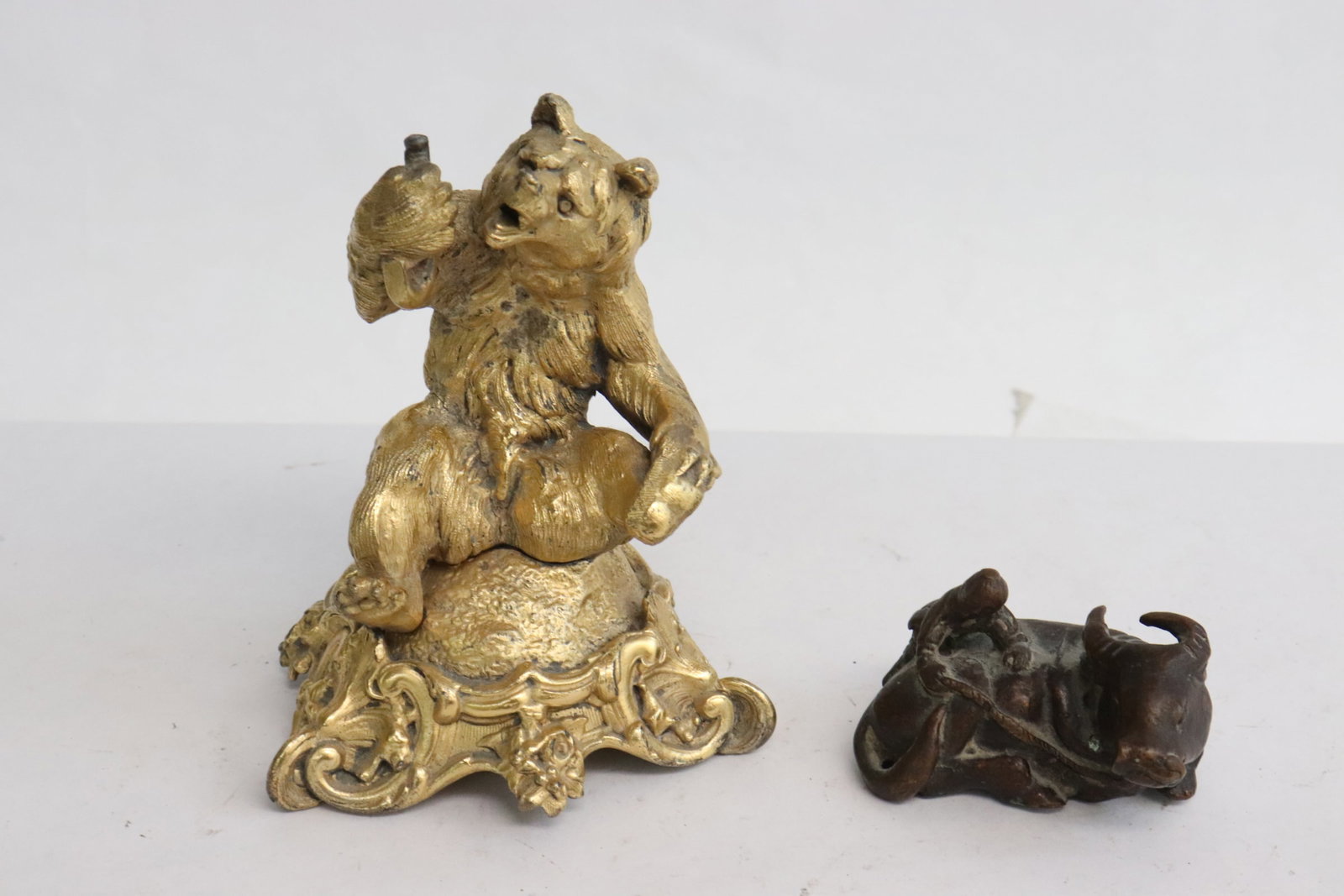 gilt metal sculpture, and a bronze sculpture: 2 pieces; gilt metal sculpture of bear (4.7"H), and a bronze sculpture of water buffalo and boy (2.5"H)