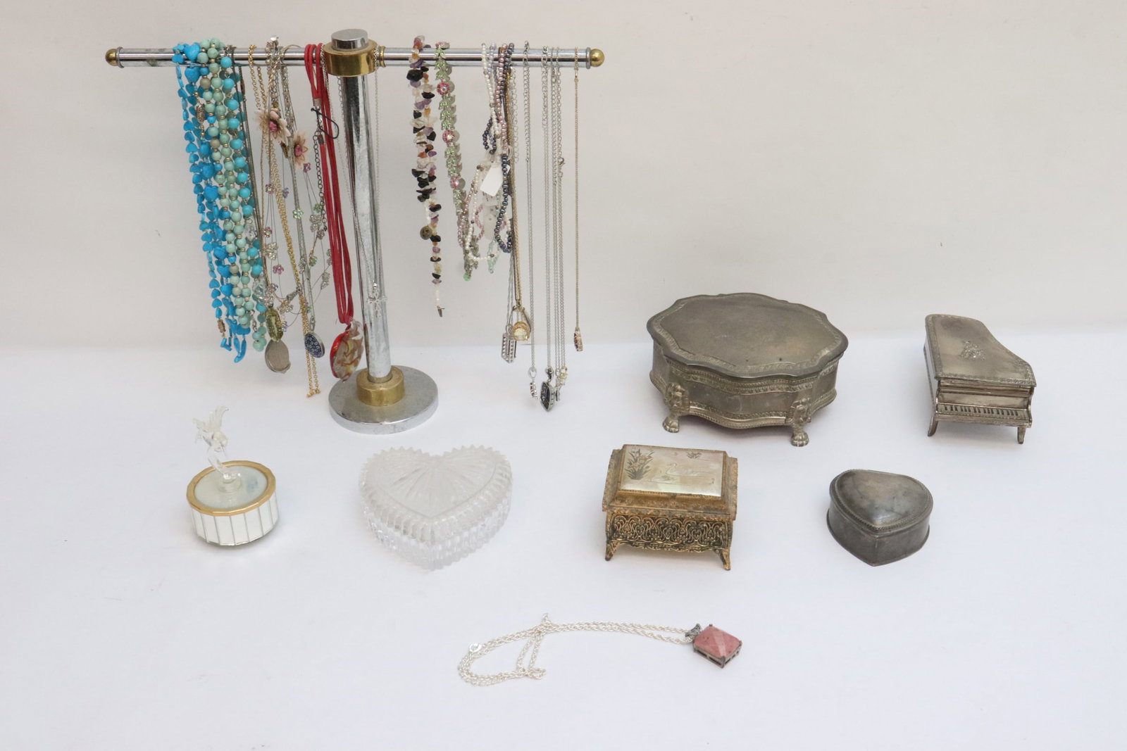 Lot of misc. necklaces, music boxes, jewelry boxes: Lot of misc. necklaces, music boxes (3.8"x2.4"dia - 2.35"x2.96"x4.3"), jewelry boxes (1.5"x3.1"x2.9" - 2.97"x5.3"x6.25"), the necklace stand in not included
