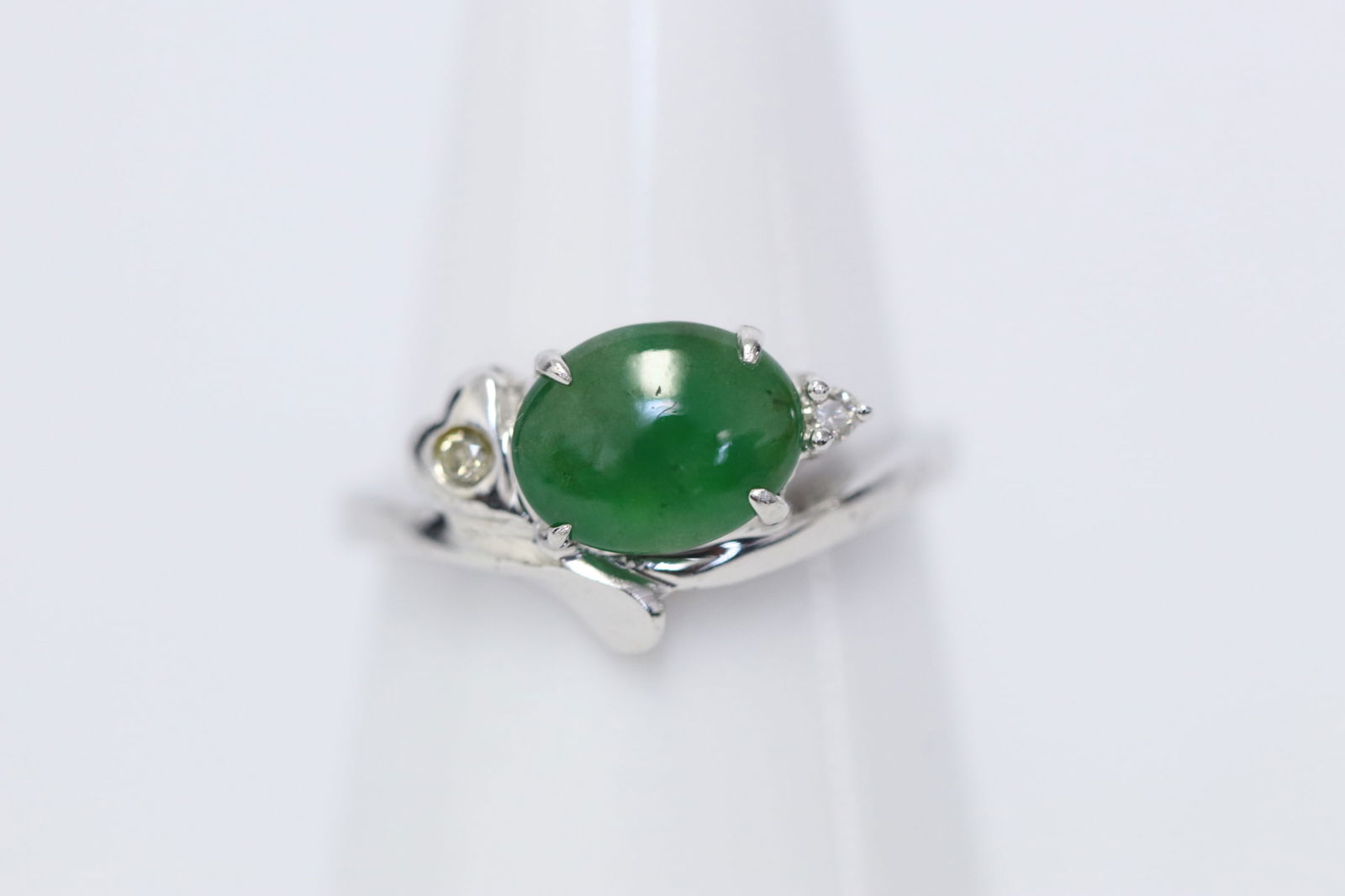 18K W/G jadeite diamond ring w/ GIA report: 18K W/G jadeite diamond ring, center a natural color brilliant apple green jadeite (GIA report) measures approx. 8.06x6.53mm, accented with small diamonds, size 5.5, wt. 2.6gm