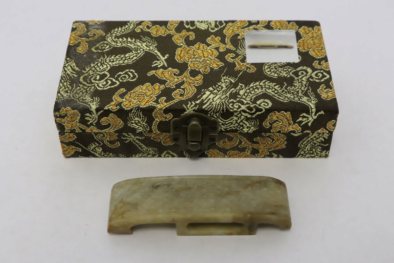 18th/19th c. celadon jade carved sword decoration: A fine 18th/19th century celadon jade carved sword decoration, 0.66"x3.65"x1.05"