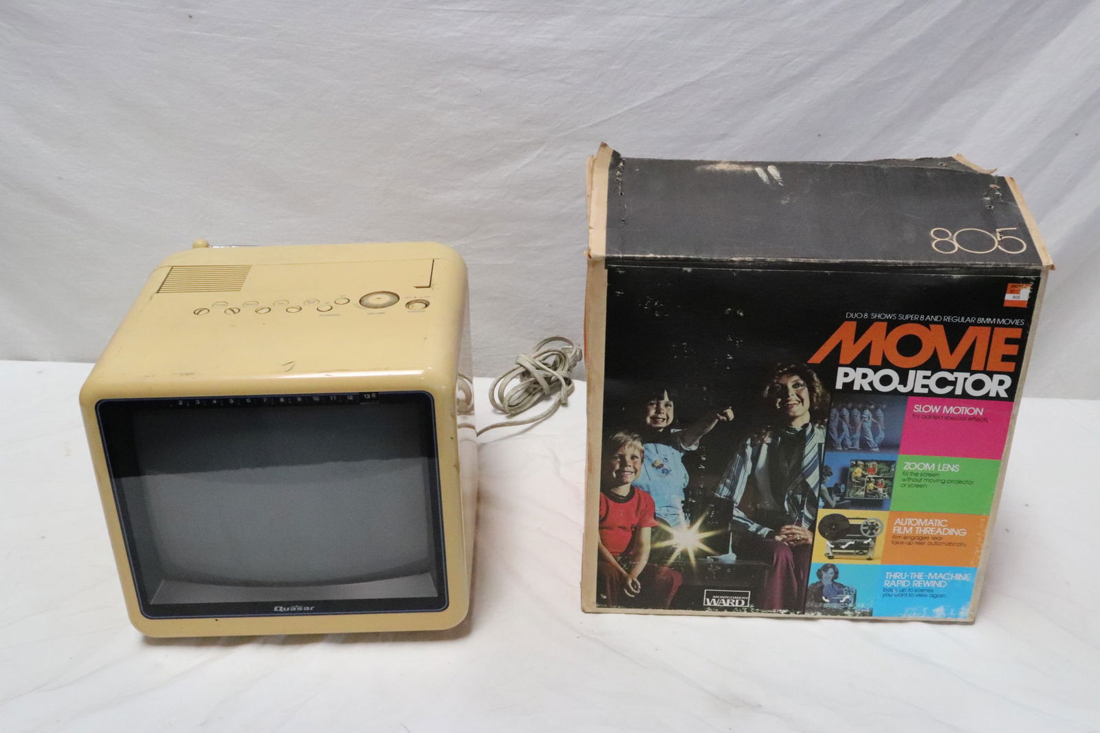 A vintage TV, and a movie projector in box: A vintage TV (10.3"x11"x13.4"), and a movie projector (11.2"x10.7"x6.8") in box