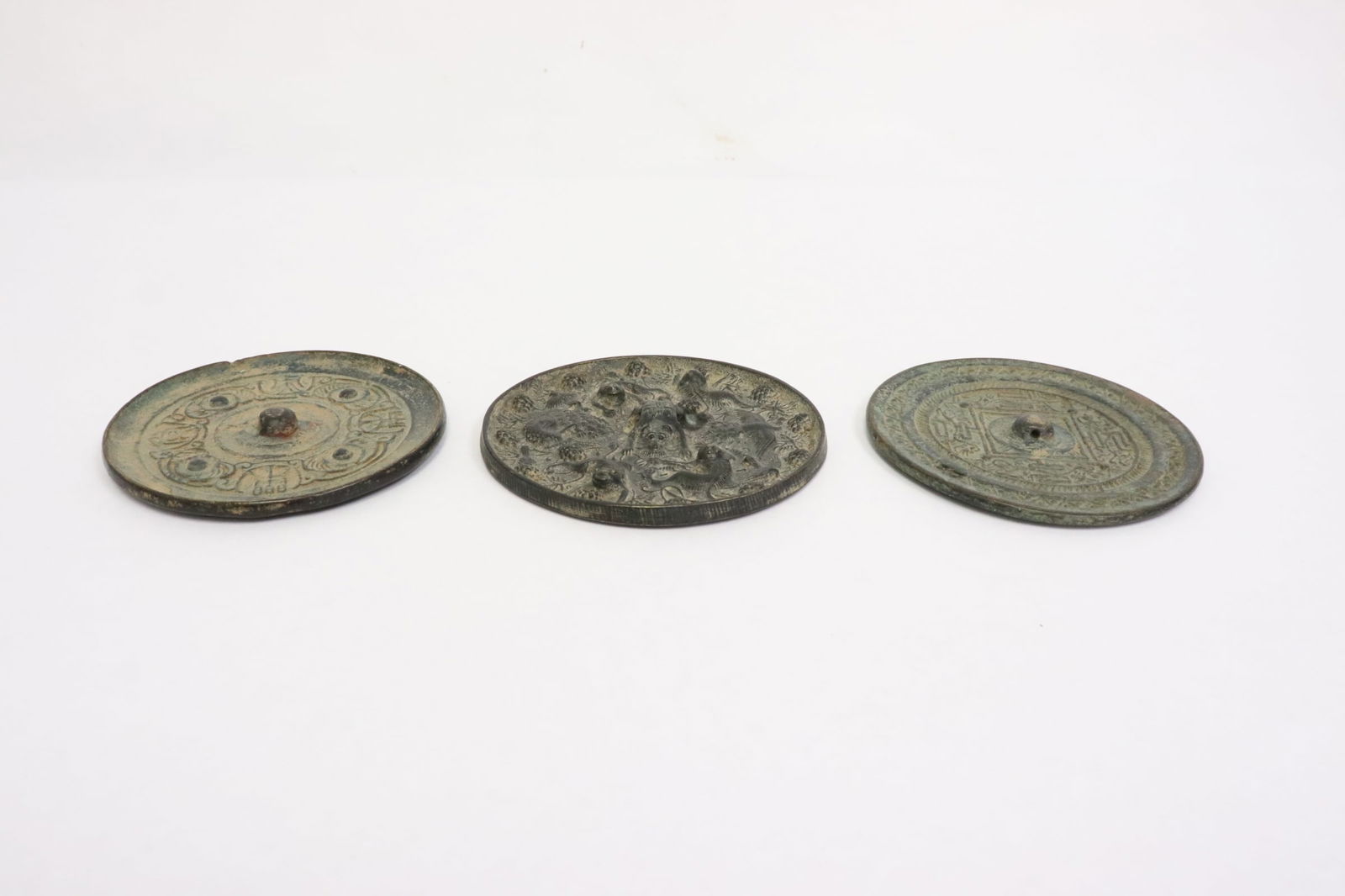 3 Chinese bronze mirrors: 3 Chinese bronze mirrors, 0.3"x3.75"dia