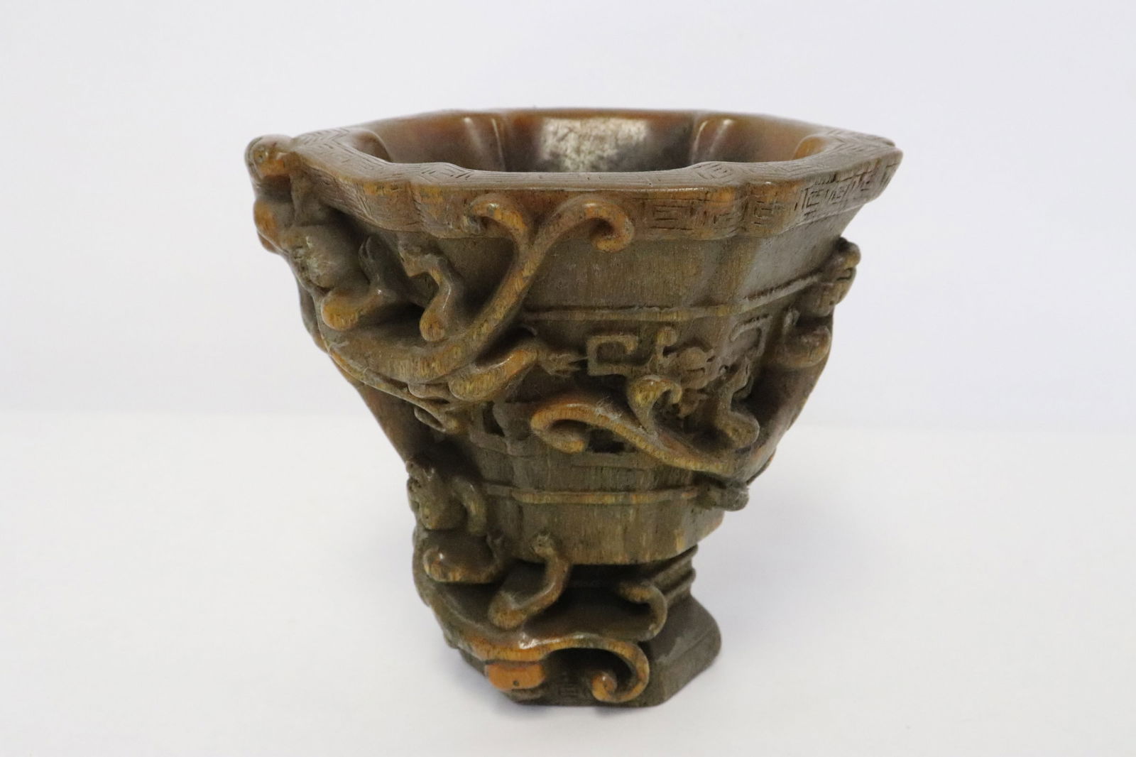A simulated horn carved libation cup (1 of 8)