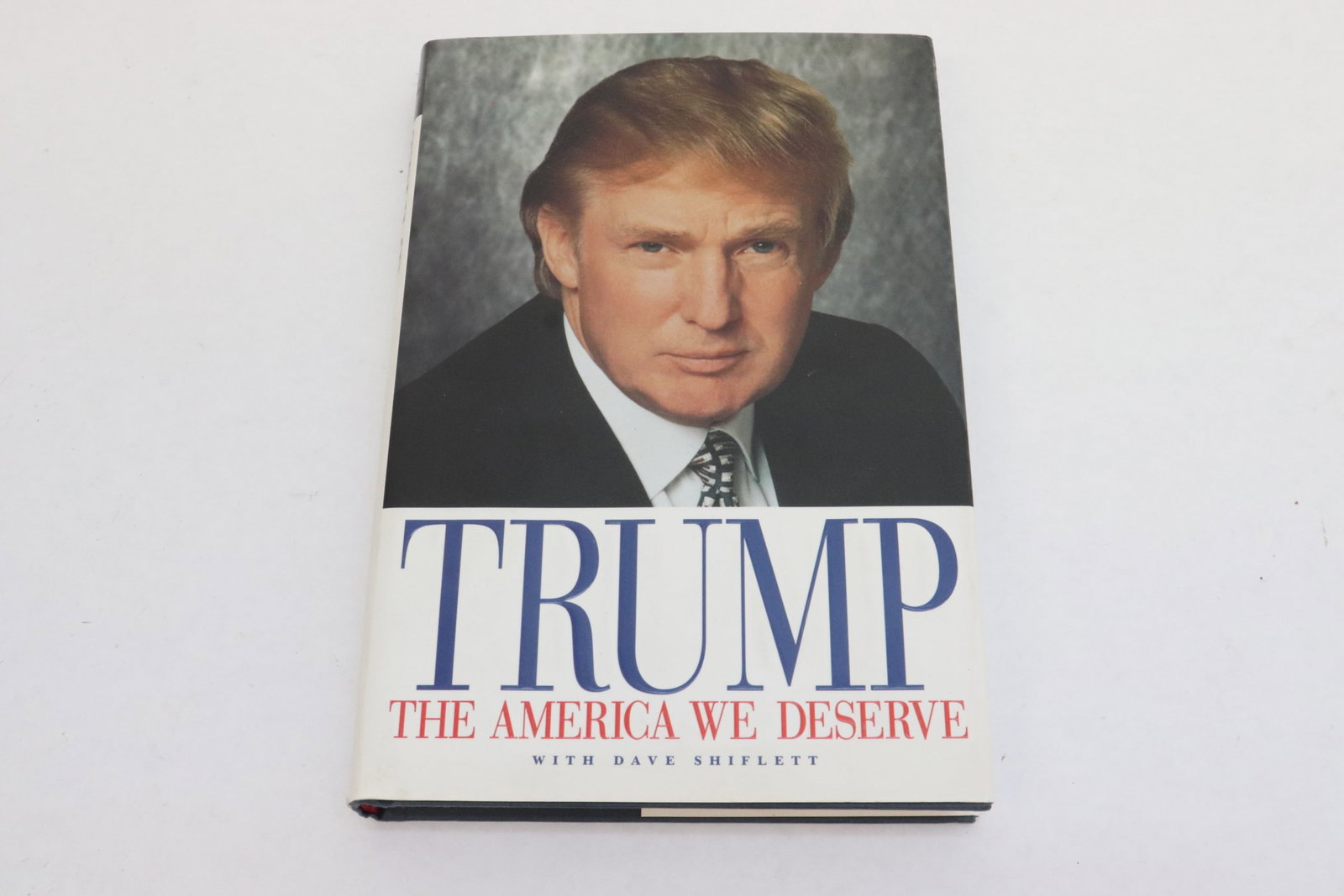 book by President Trump w/ Dave Shiflett, signed by President Donald Trump: Trump, the America we deserve" by President Donald Trump with Dave Shiflett, signed by President Donald Trump, 0.9"x9.3"x6.3
